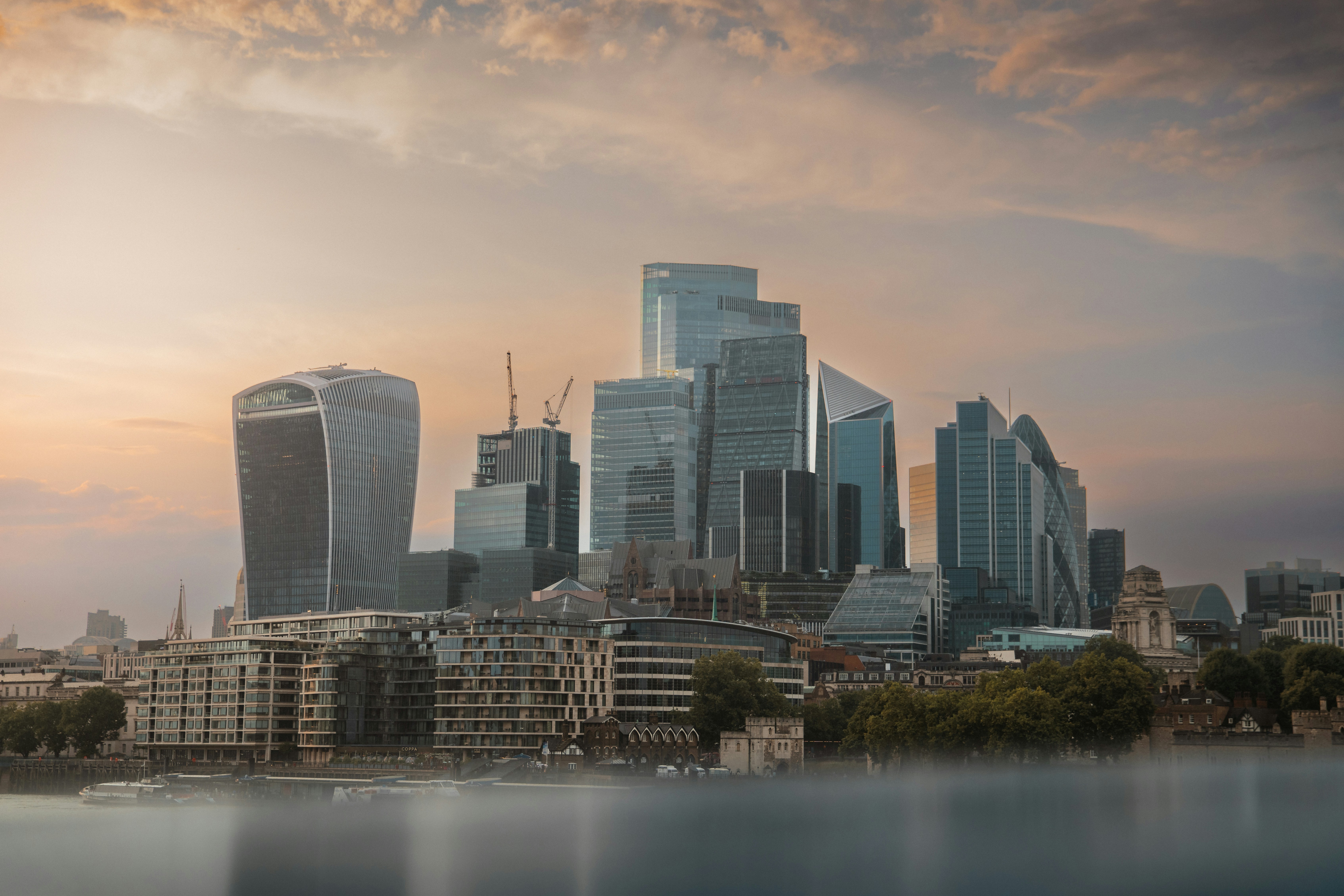 A view of a city with a lake in front of it