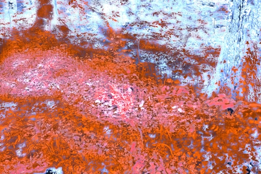 An abstract painting of a red and blue area