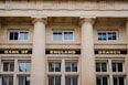 A bank of england building with three pillars