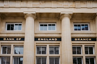 A bank of england building with three pillars