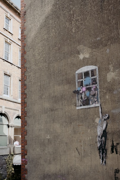 A building with a window and a sticker on the side of it