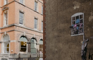 A tall building with a window on the side of it