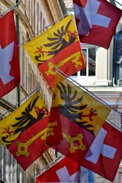 A bunch of flags that are flying in the air