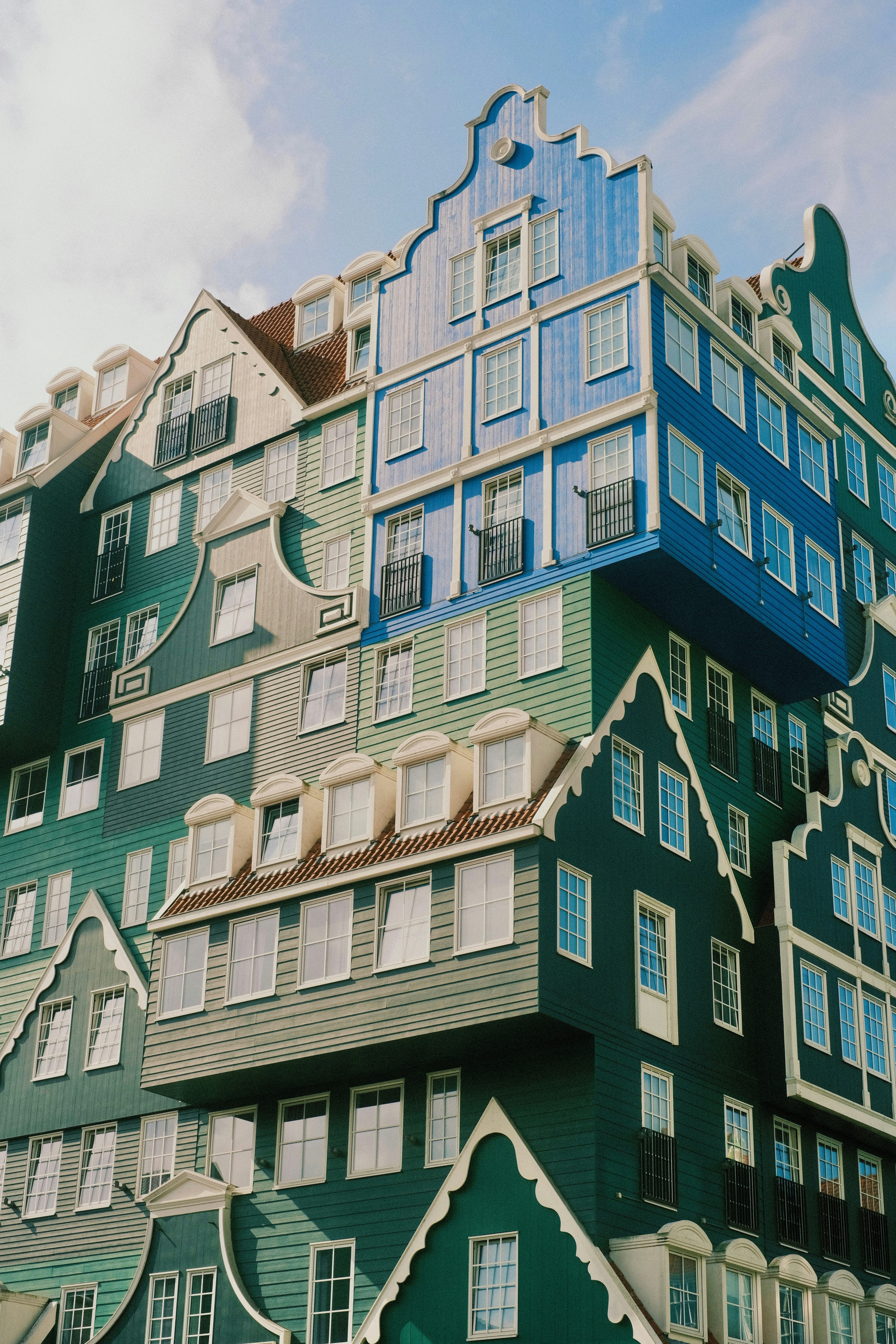 A very tall building with many windows and balconies