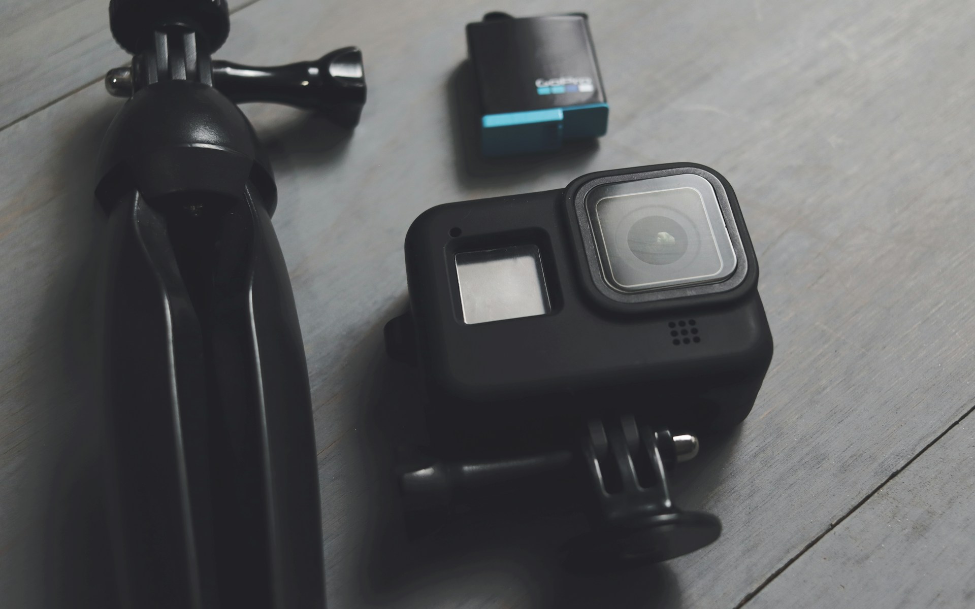 A couple of cameras sitting on top of a wooden floor