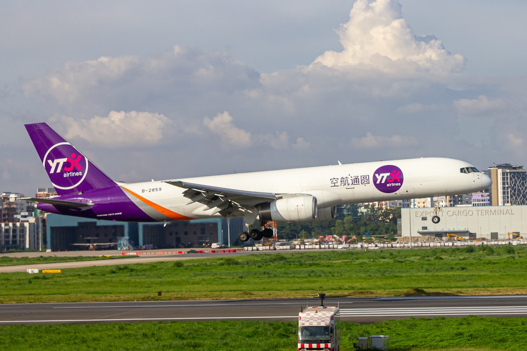 A large jetliner taking off from an airport runway, YTO Cargo Airlines Boeing 757-200