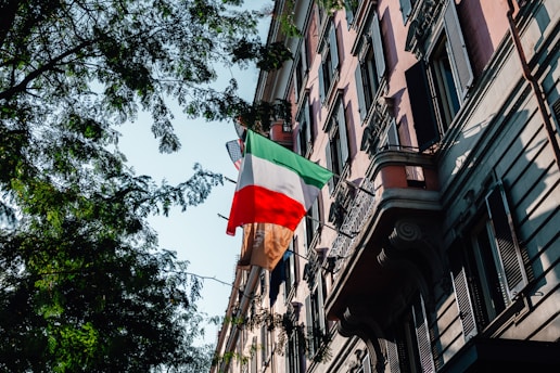 A building with a flag hanging off of it's side
