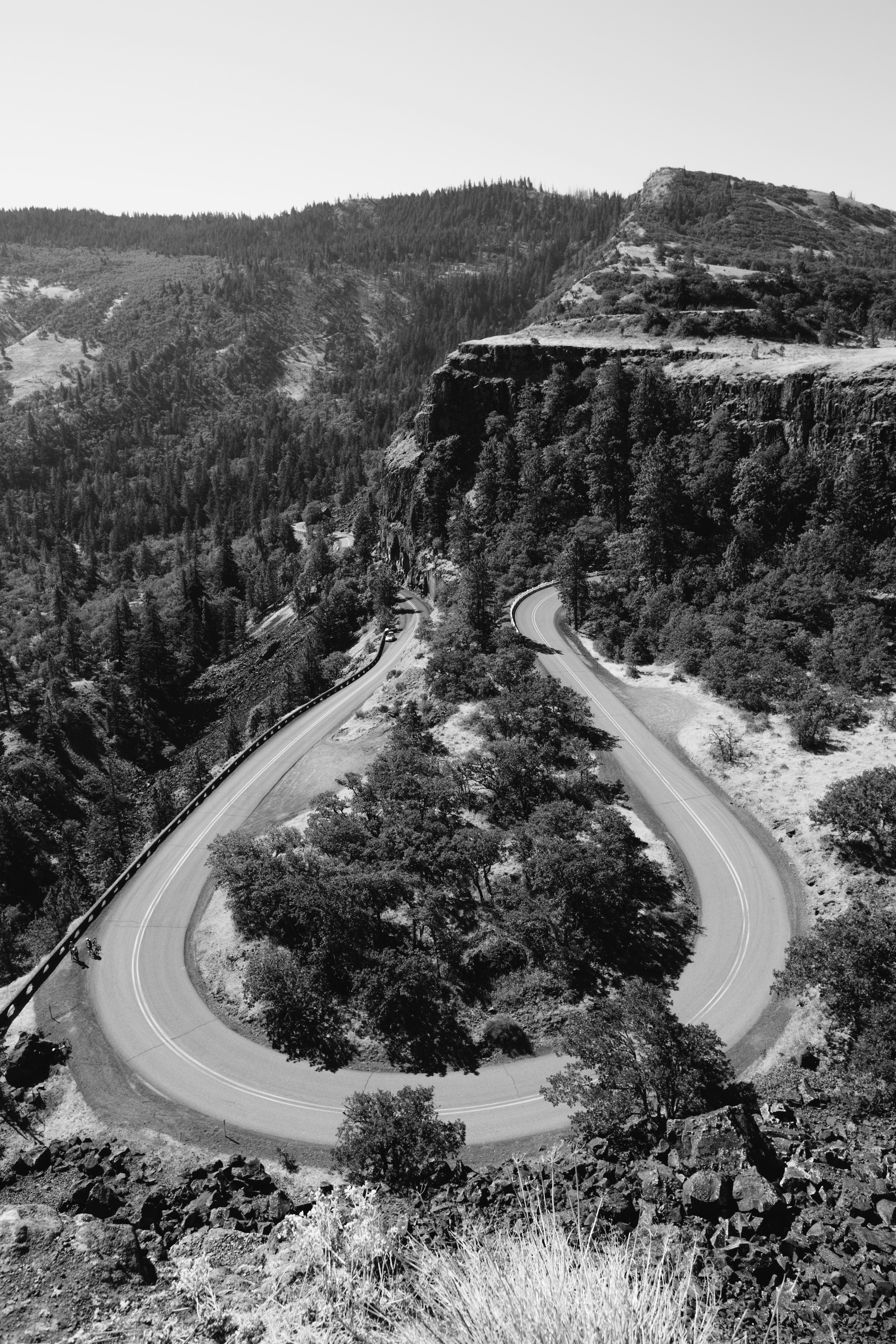 A winding road in the middle of a mountain