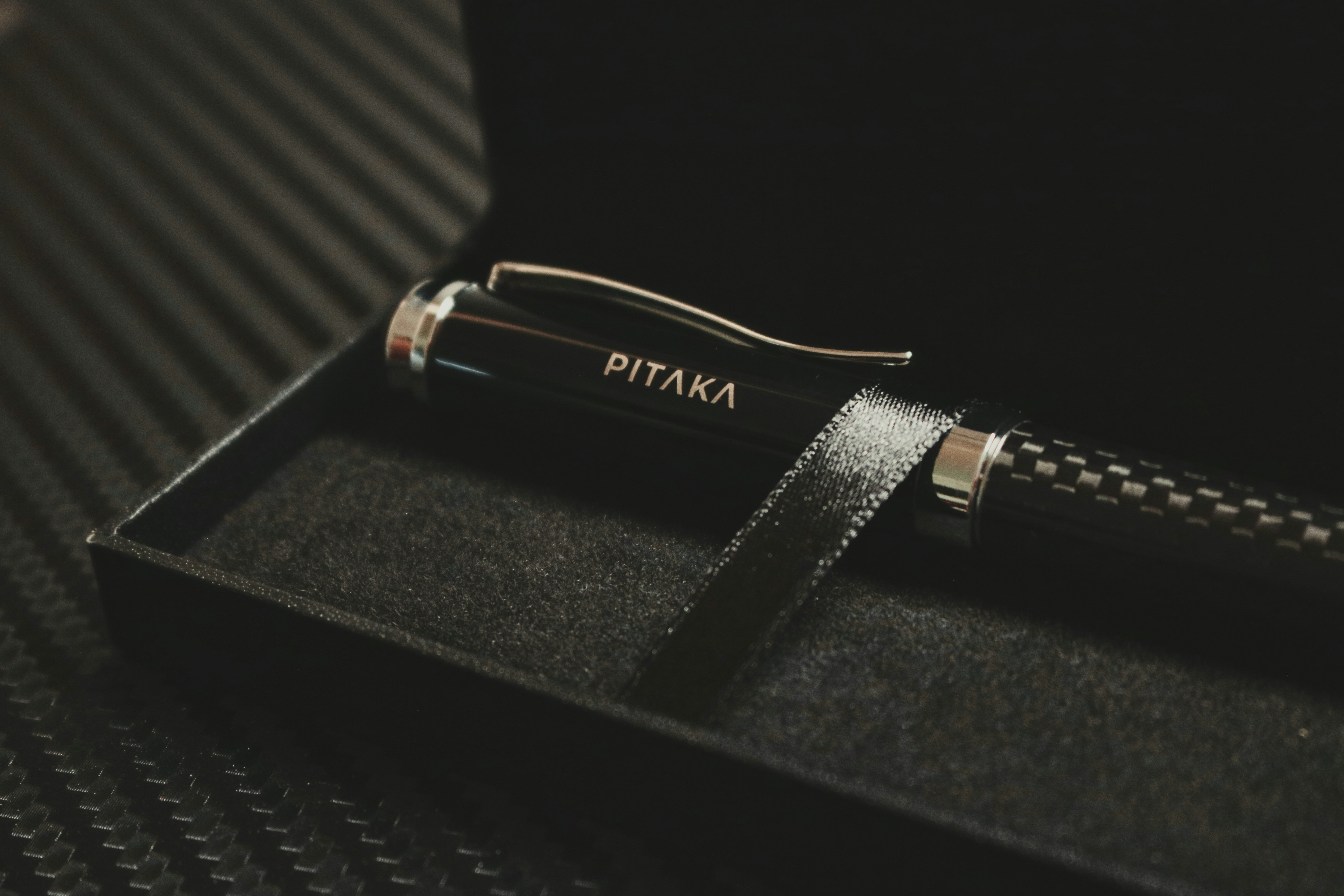 A pen sitting in a box on a table