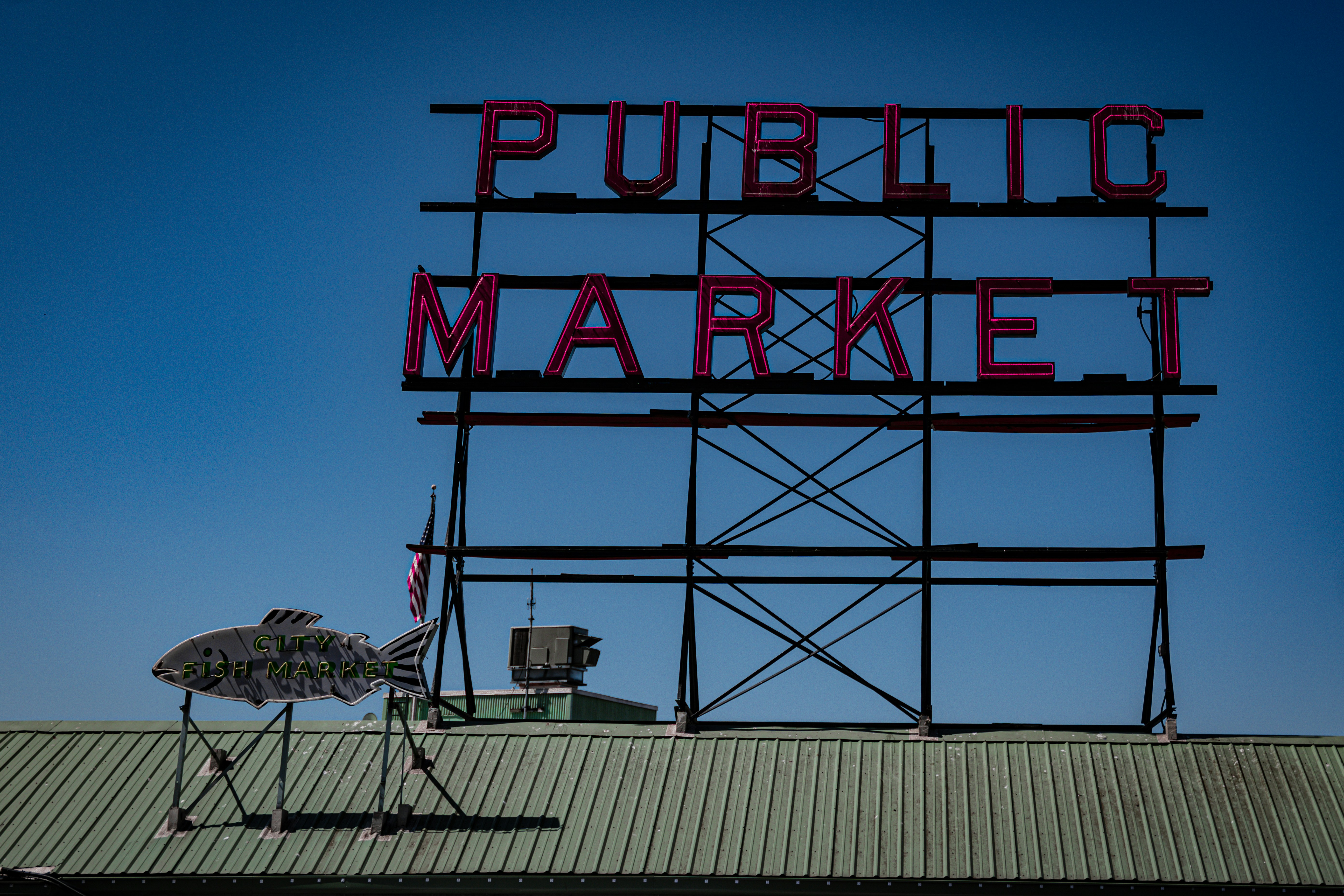 A sign that says public market on top of a building