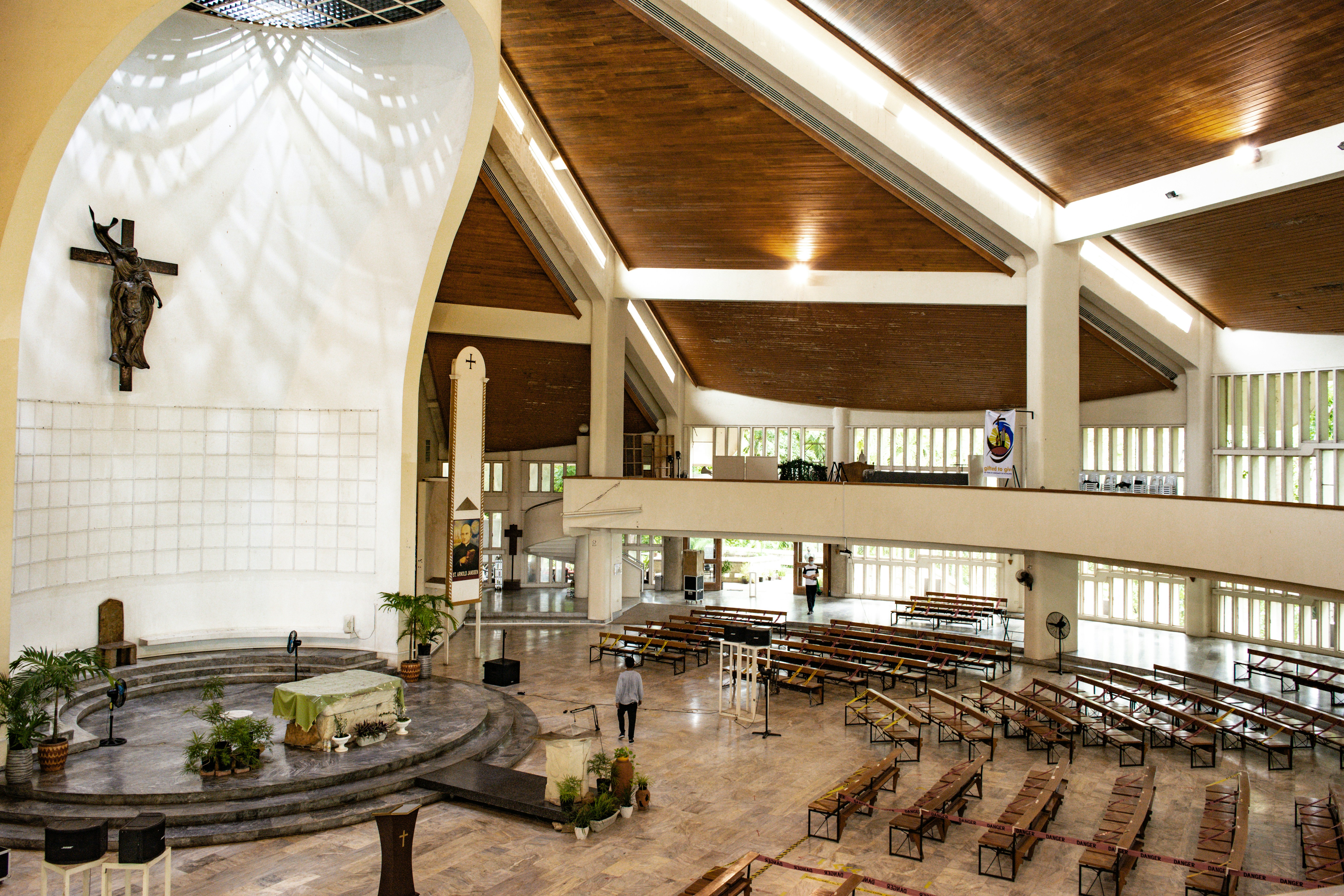 A large church with a cross on the wall
