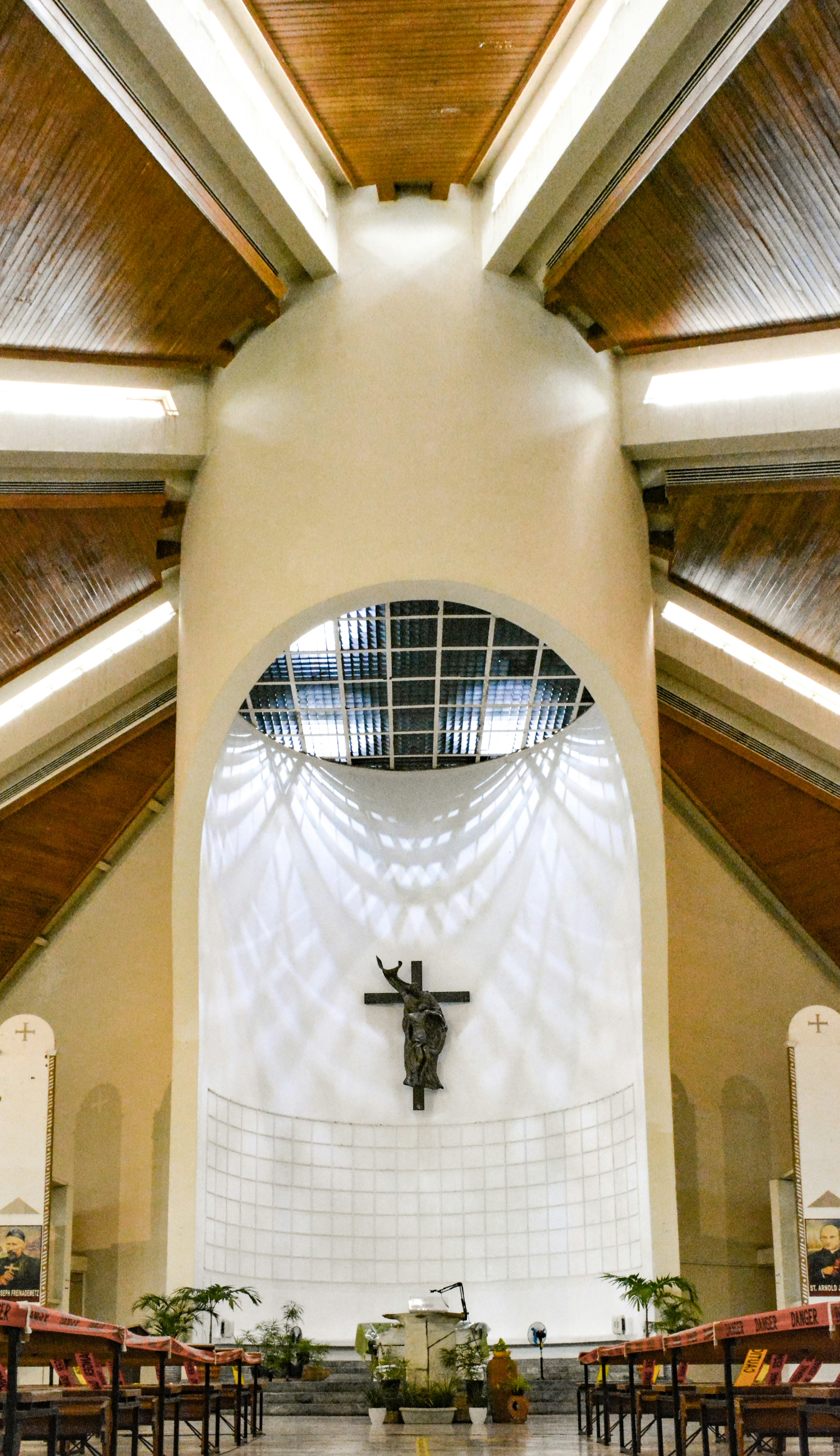 The inside of a church with a cross on the wall