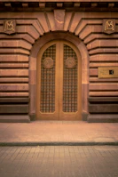 A building with a large wooden door on the side of it