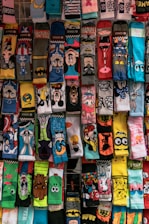 A display of socks with cartoon faces on them