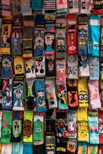A display of socks with cartoon faces on them