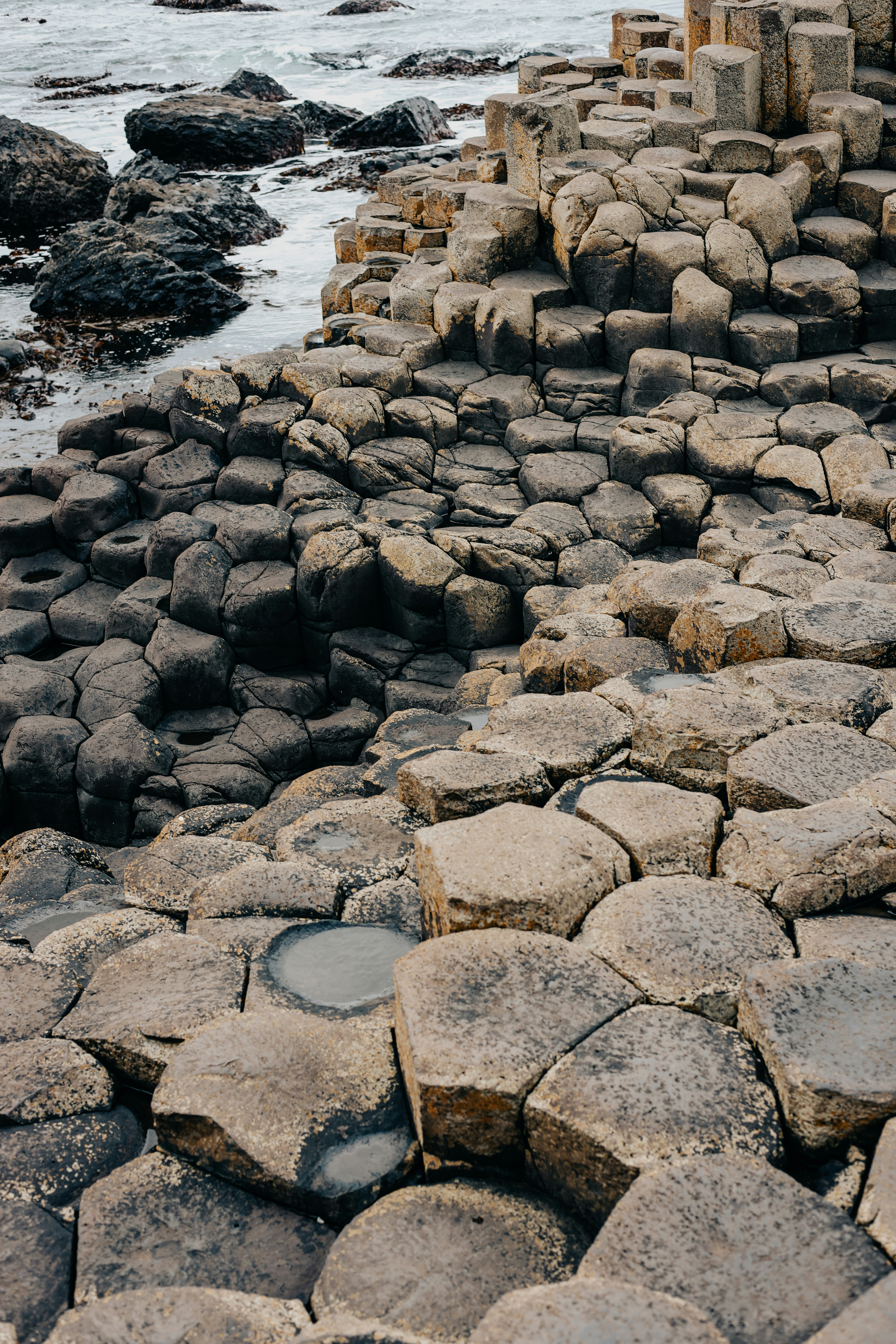 A large rock formation near a body of water
