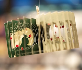 A close up of a person holding a card