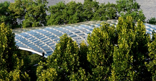 An aerial view of a building surrounded by trees