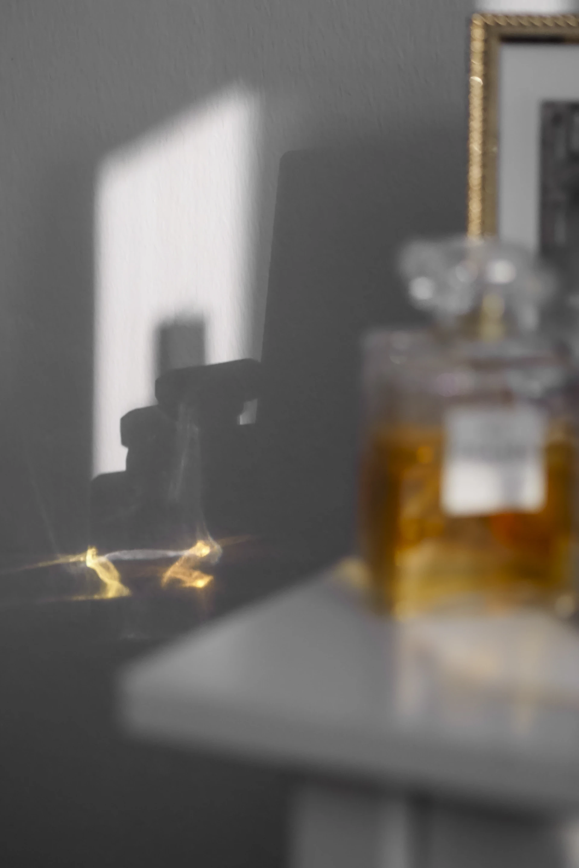 A table with a mirror and a bottle of honey on it