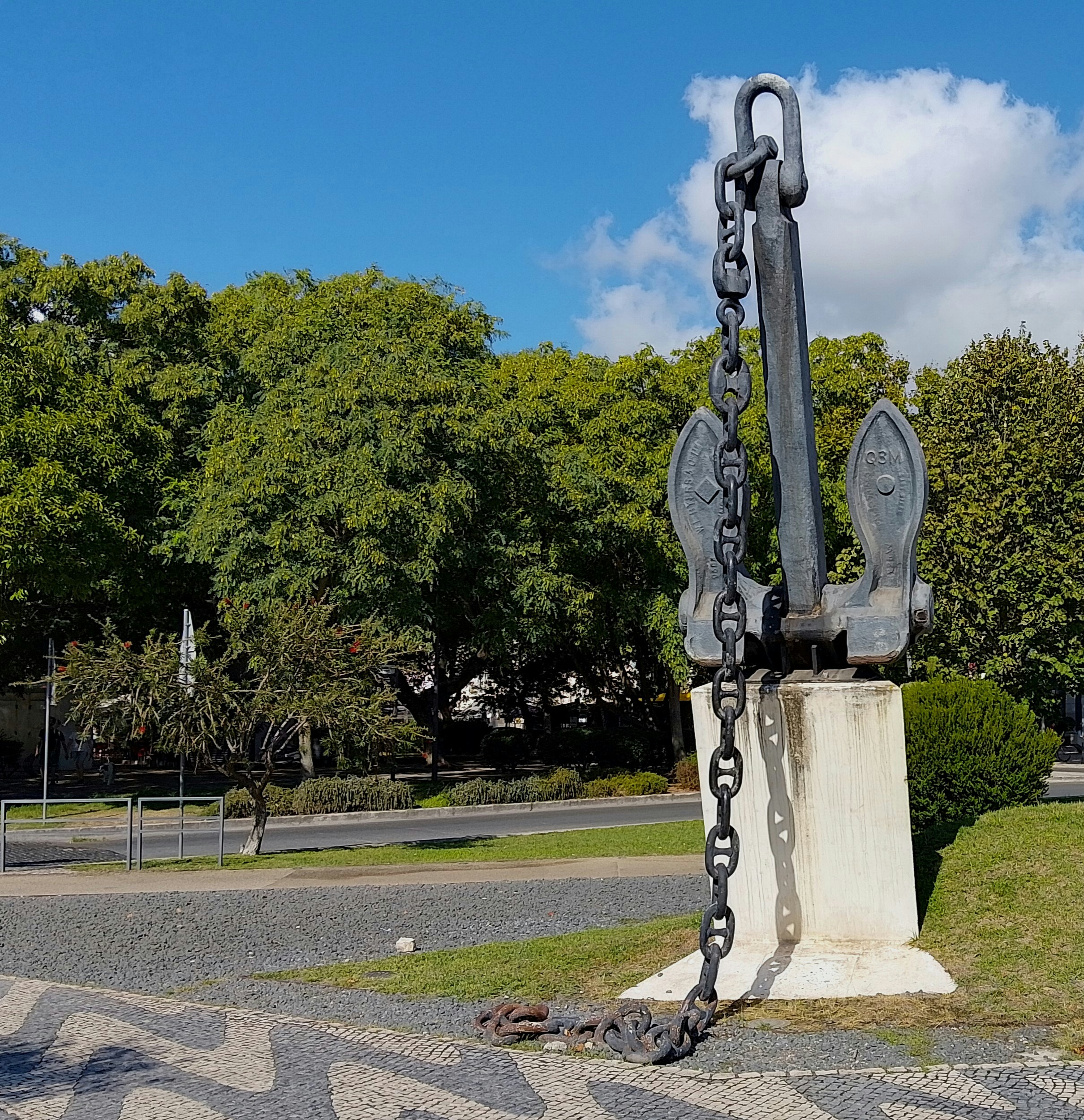 A statue of an anchor with a chain attached to it