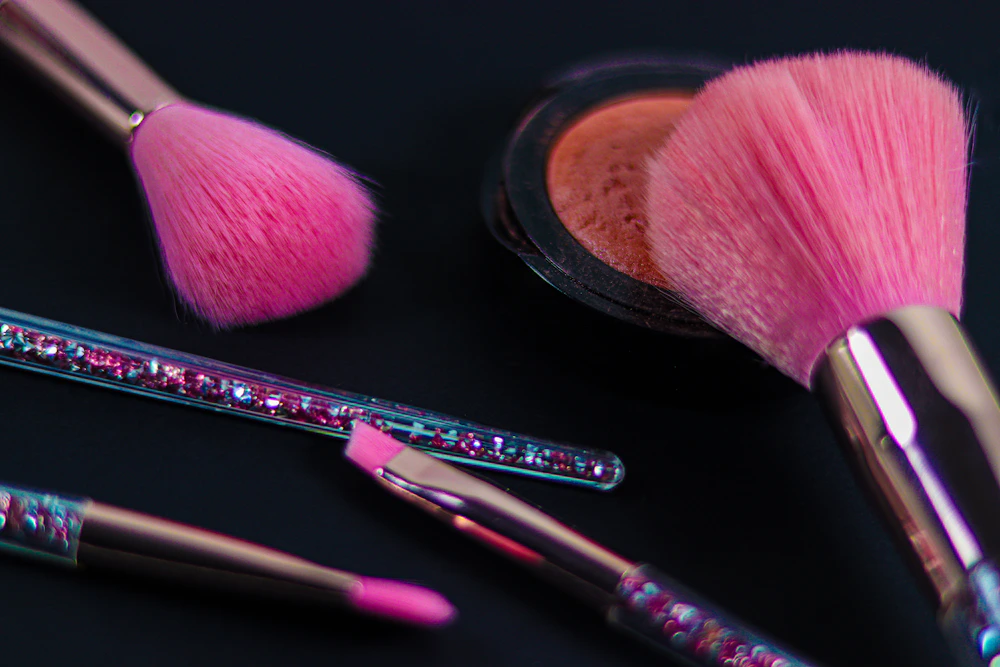 Makeup brushes and cosmetics for refreshing a fall beauty routine