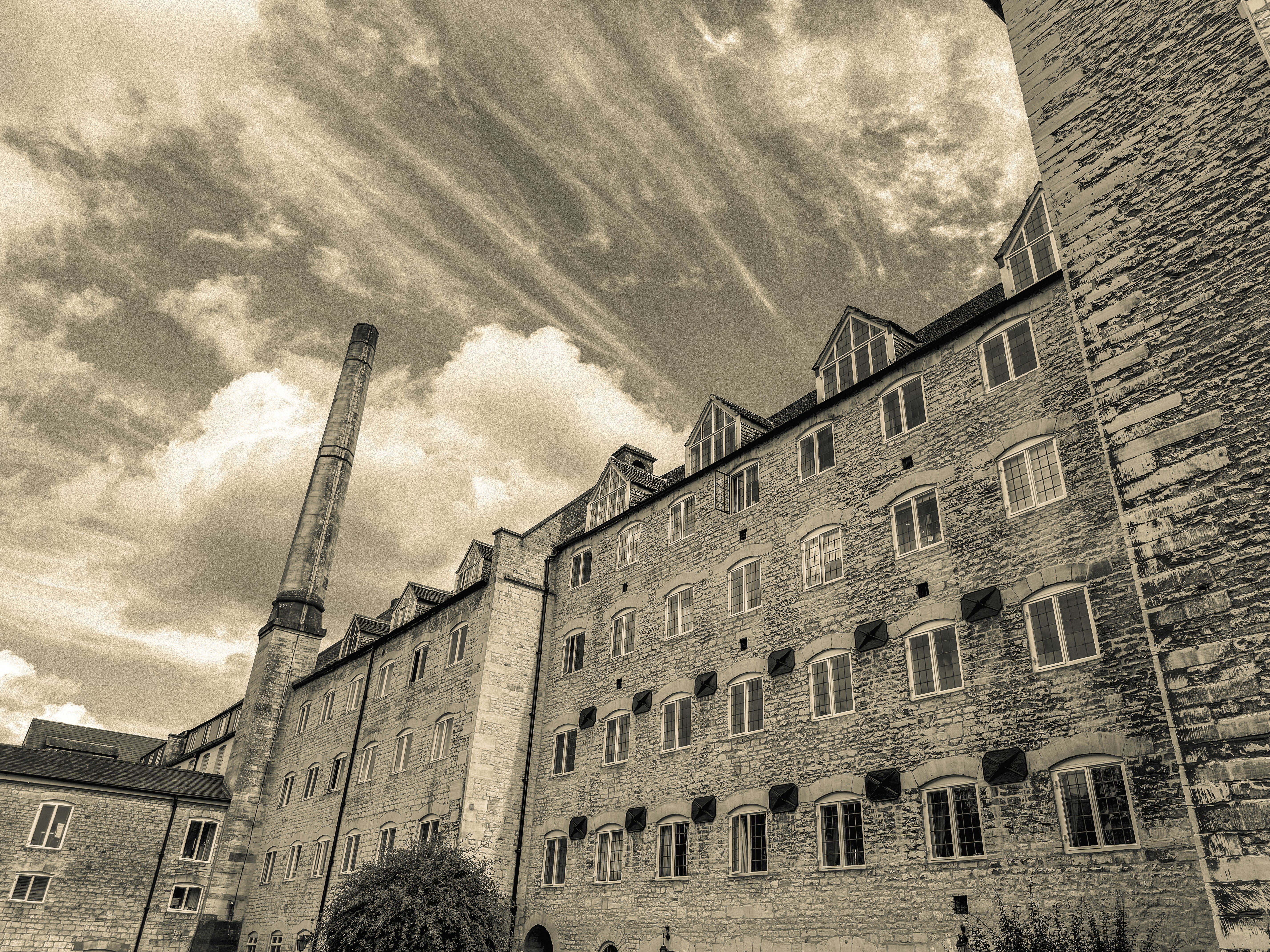A black and white photo of a tall building