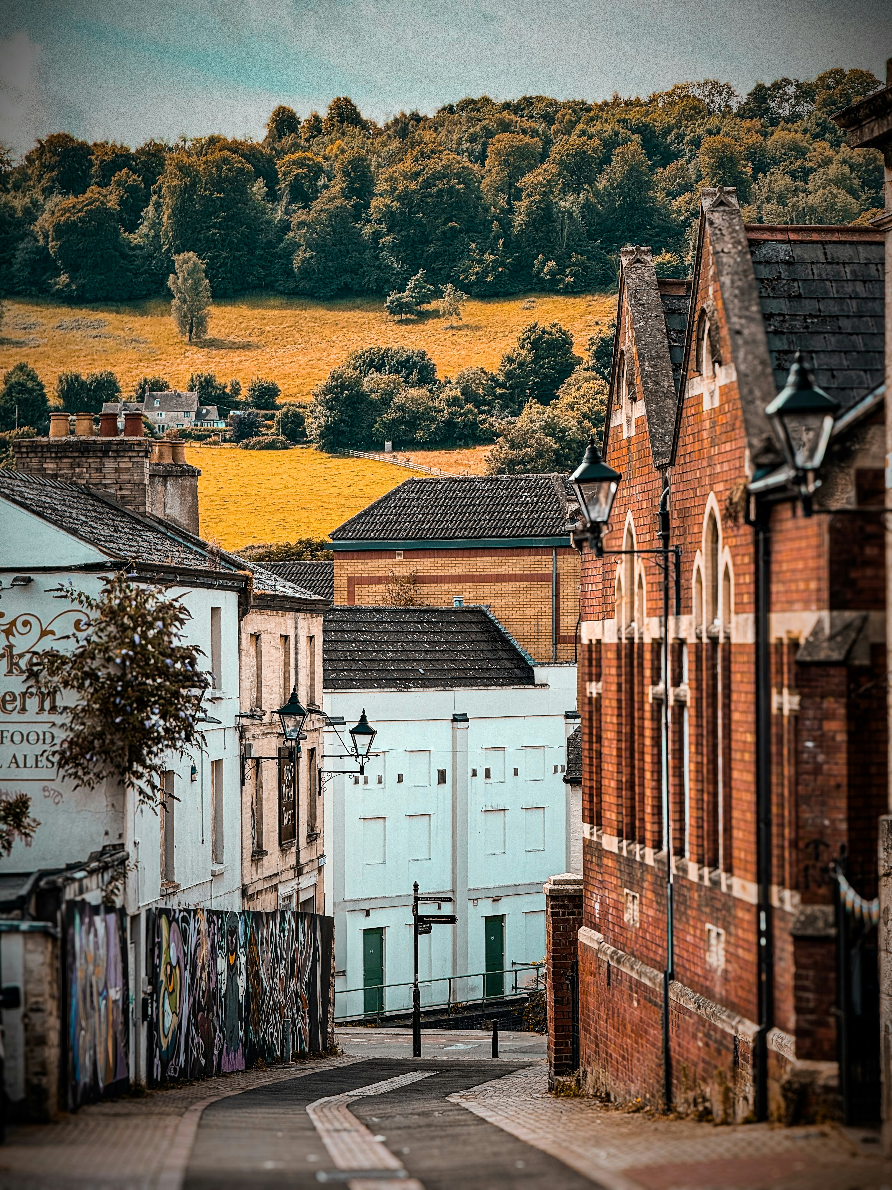 A city street with a hill in the background