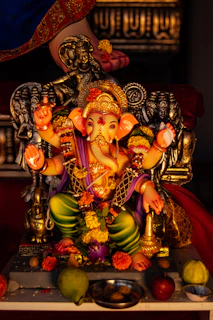 A statue of an elephant sitting on top of a table