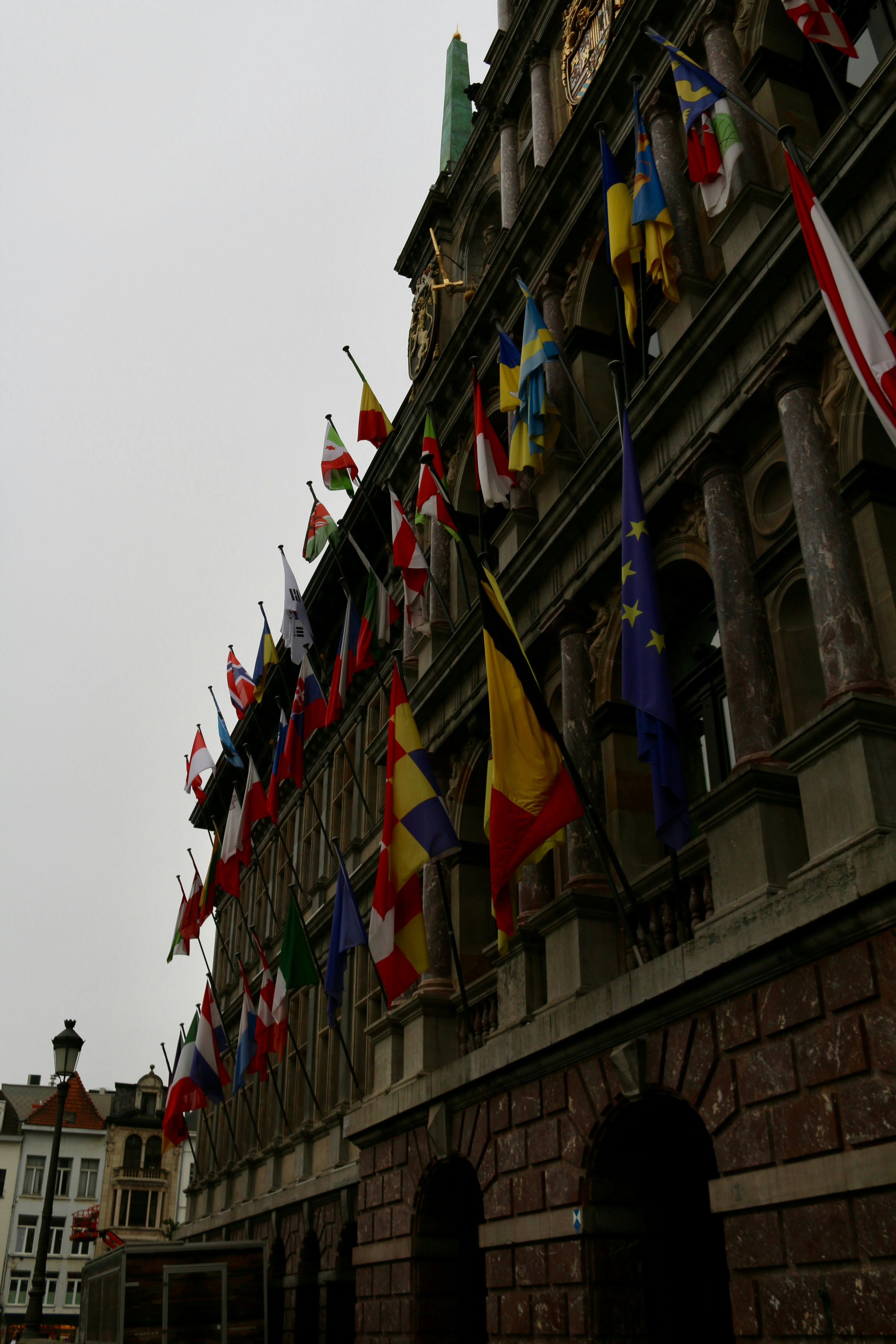 Government building with flags representing international cooperation