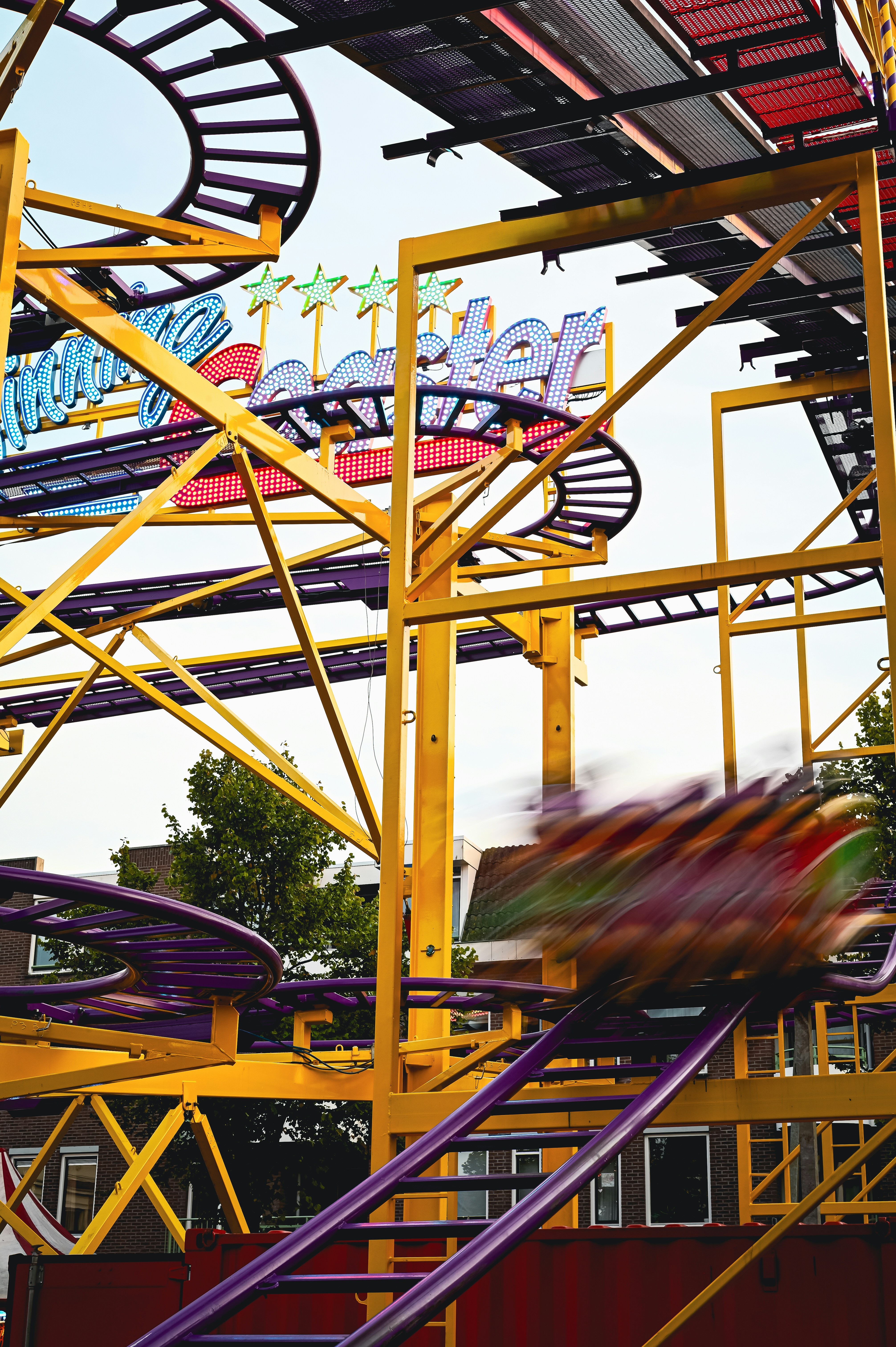A person riding a roller coaster at a theme park