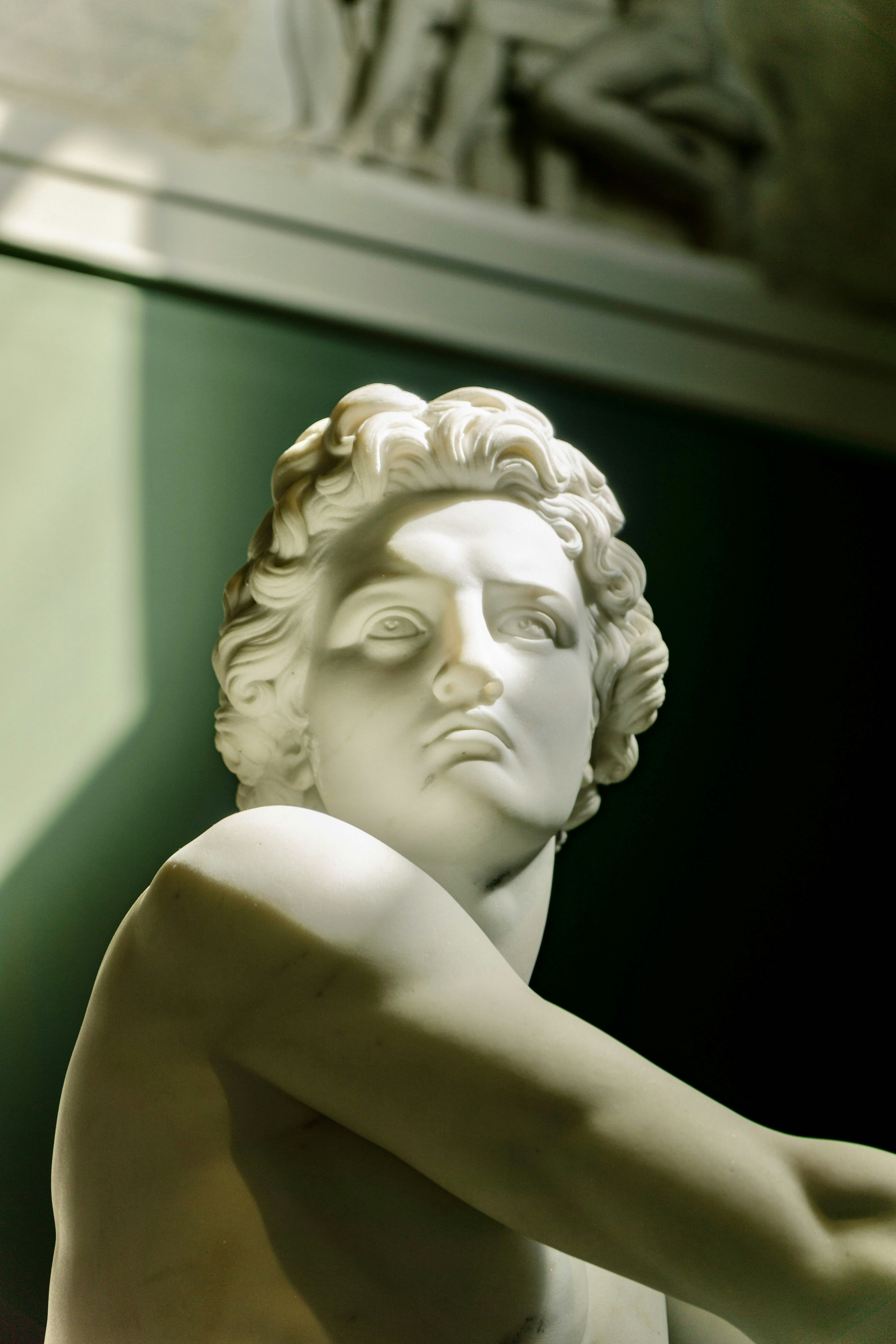 A statue of a man with his arms crossed