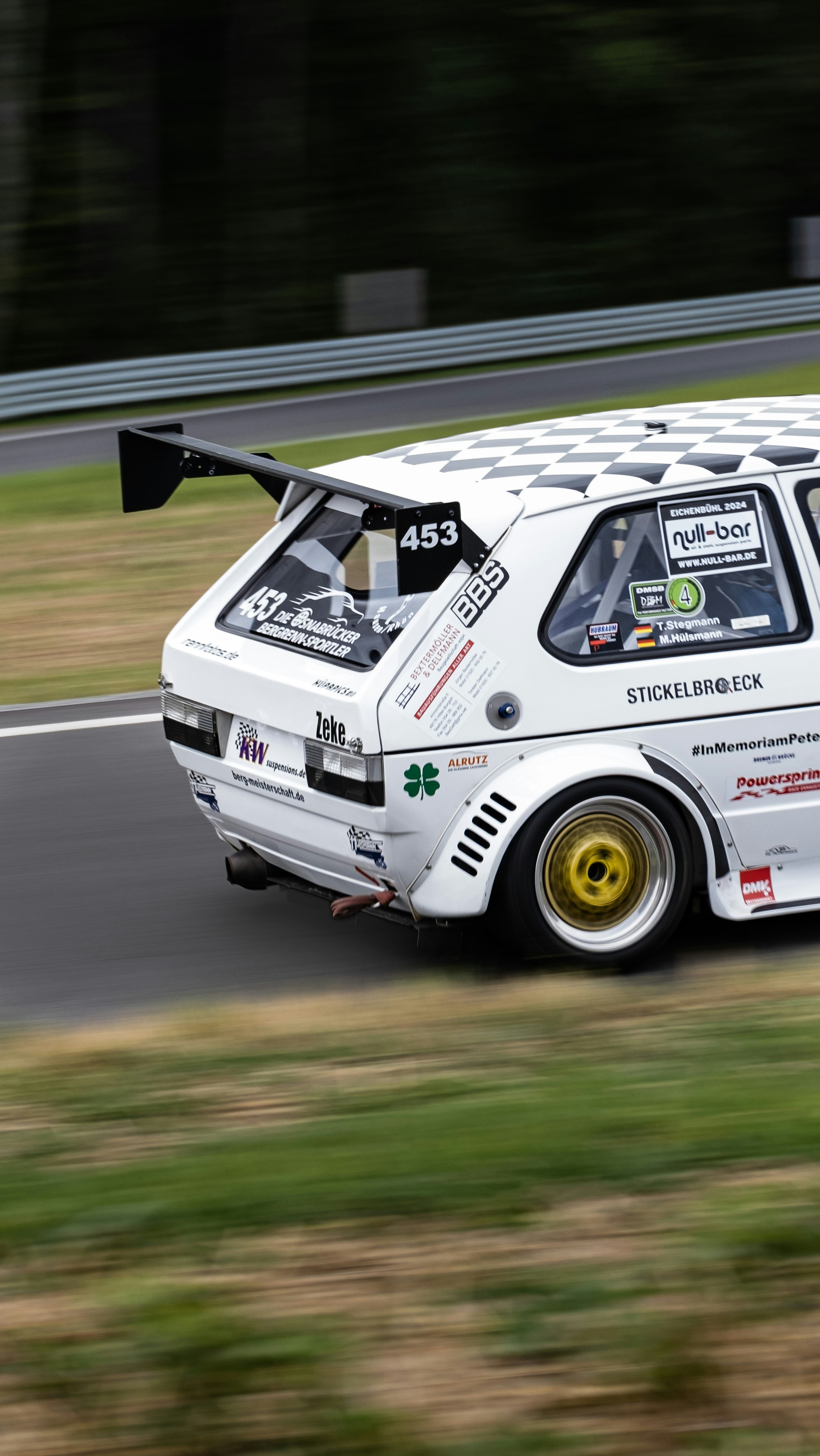 A white car driving down a race track photo – Free Car Image on Unsplash