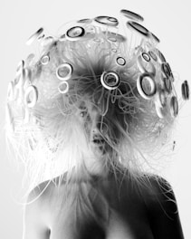 A black and white photo of a woman's head