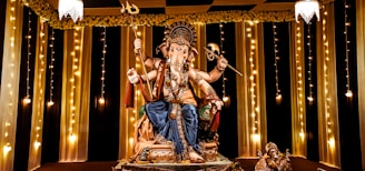 A statue of a man sitting on top of a table