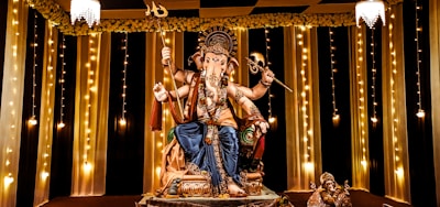 A statue of a man sitting on top of a table