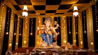 A statue of a man sitting on top of a stage