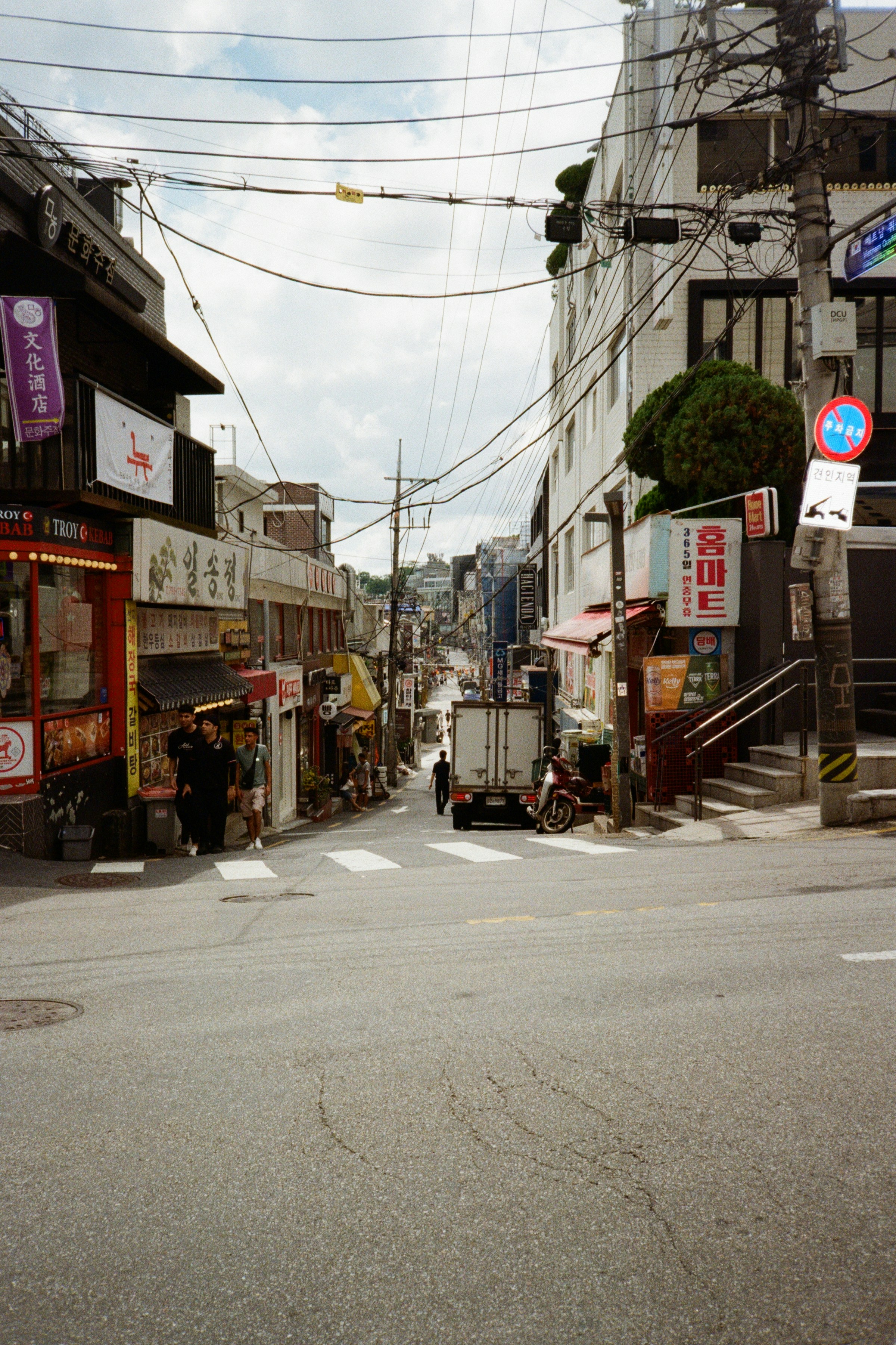 A city street with a few shops on the side of it