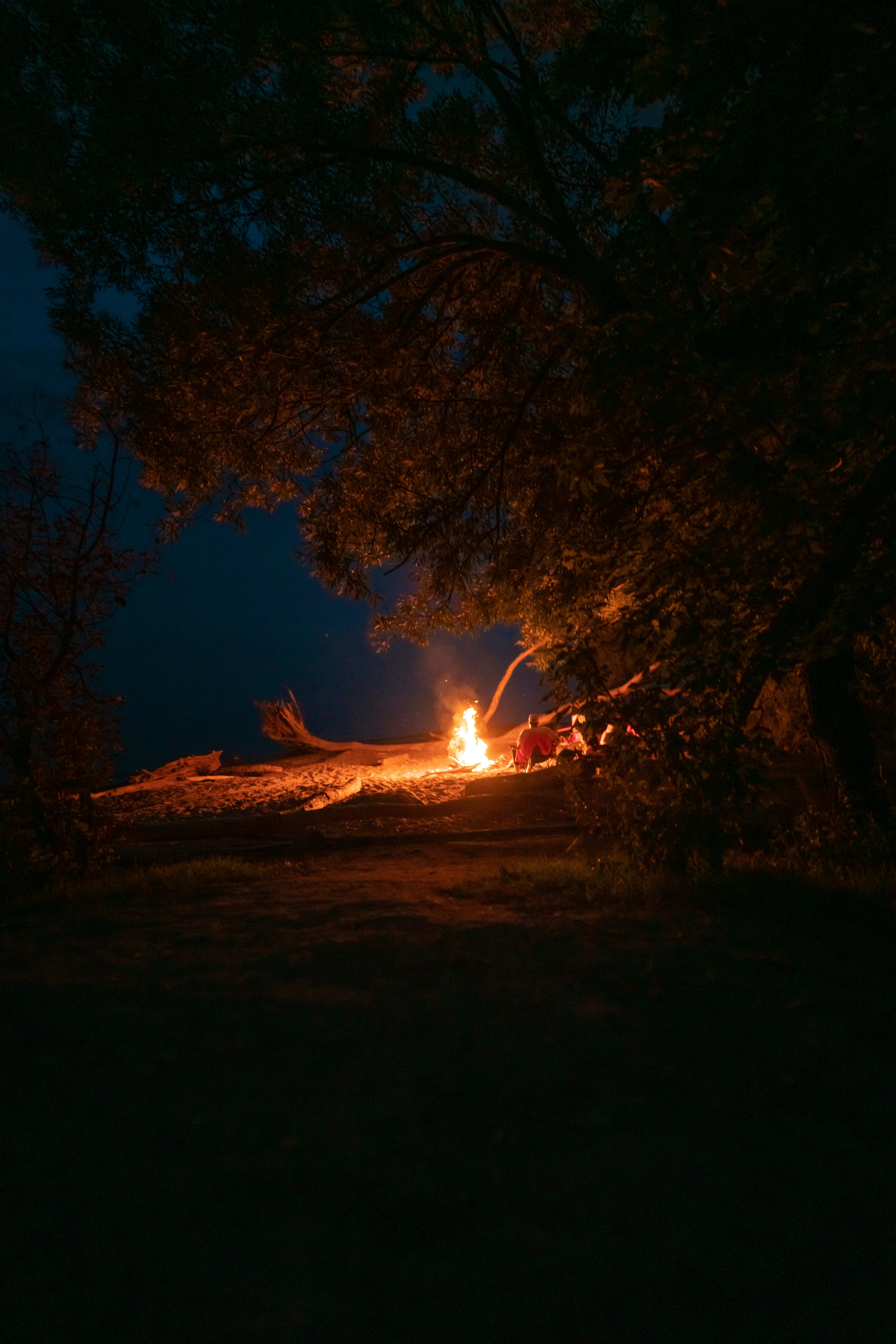 A fire is lit up in the dark