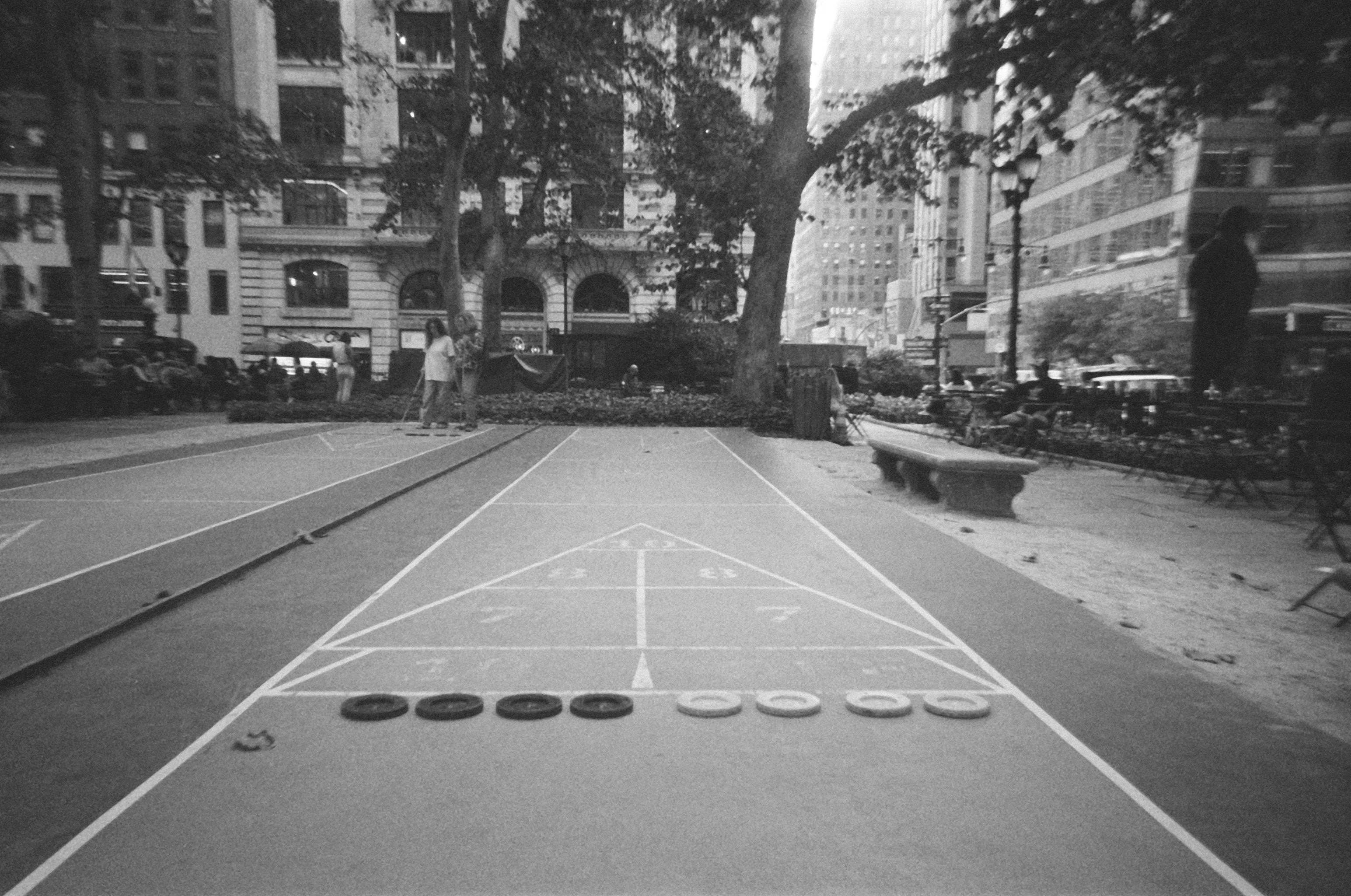 Black and white film photo of Shuffleboard Game in Bryant Park, Manhattan, New York