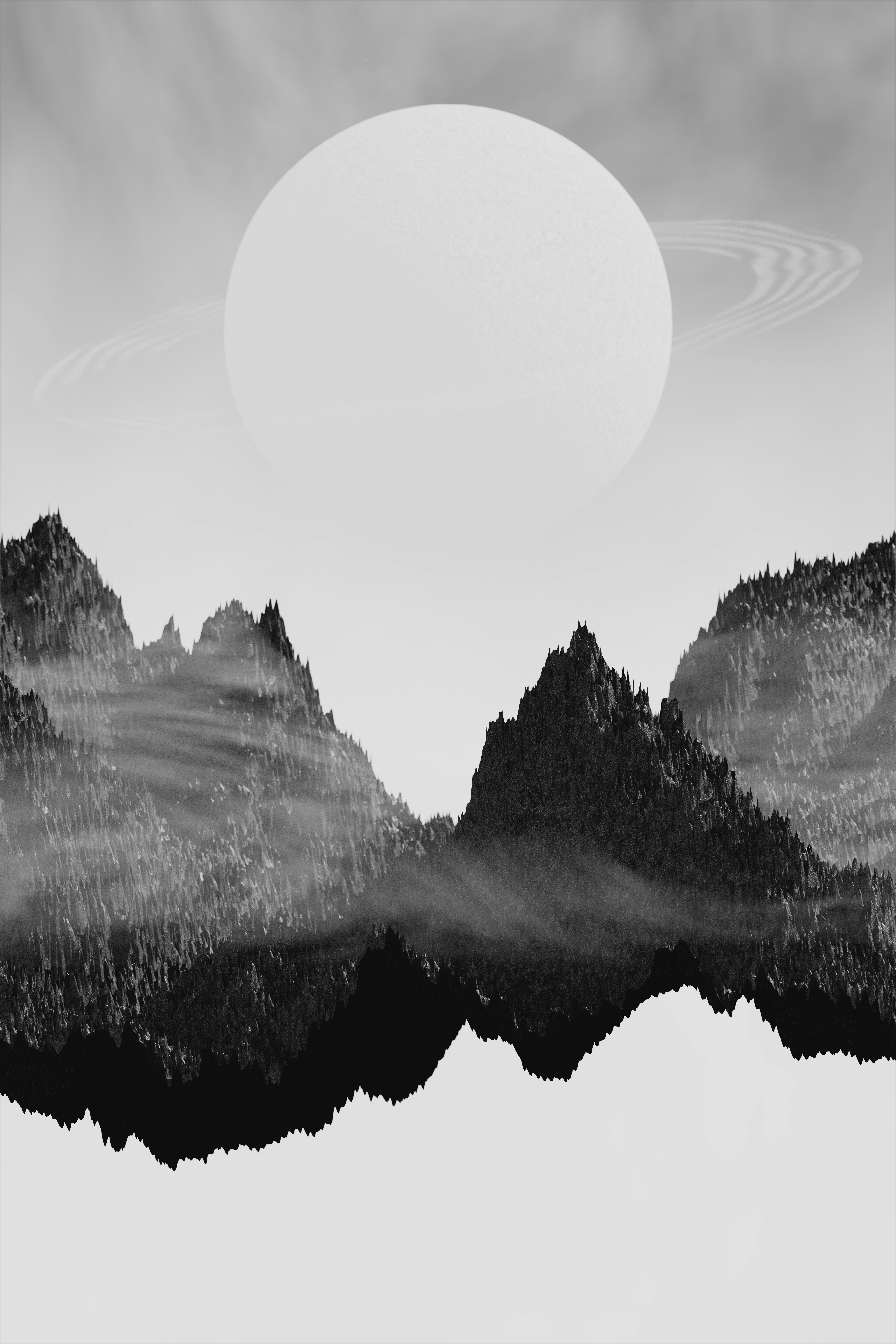 Una foto in bianco e nero di una catena montuosa