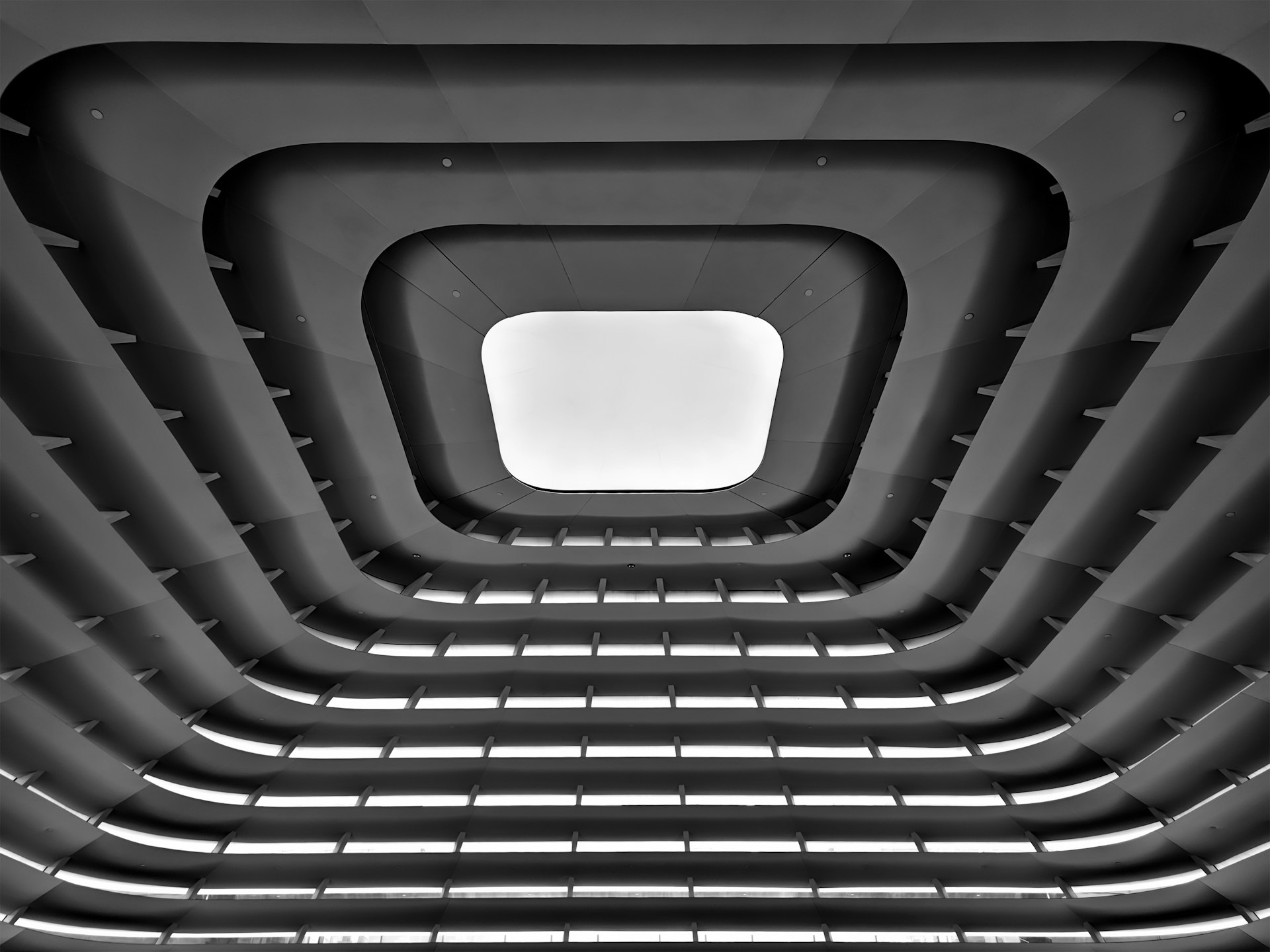 A black and white photo of a ceiling