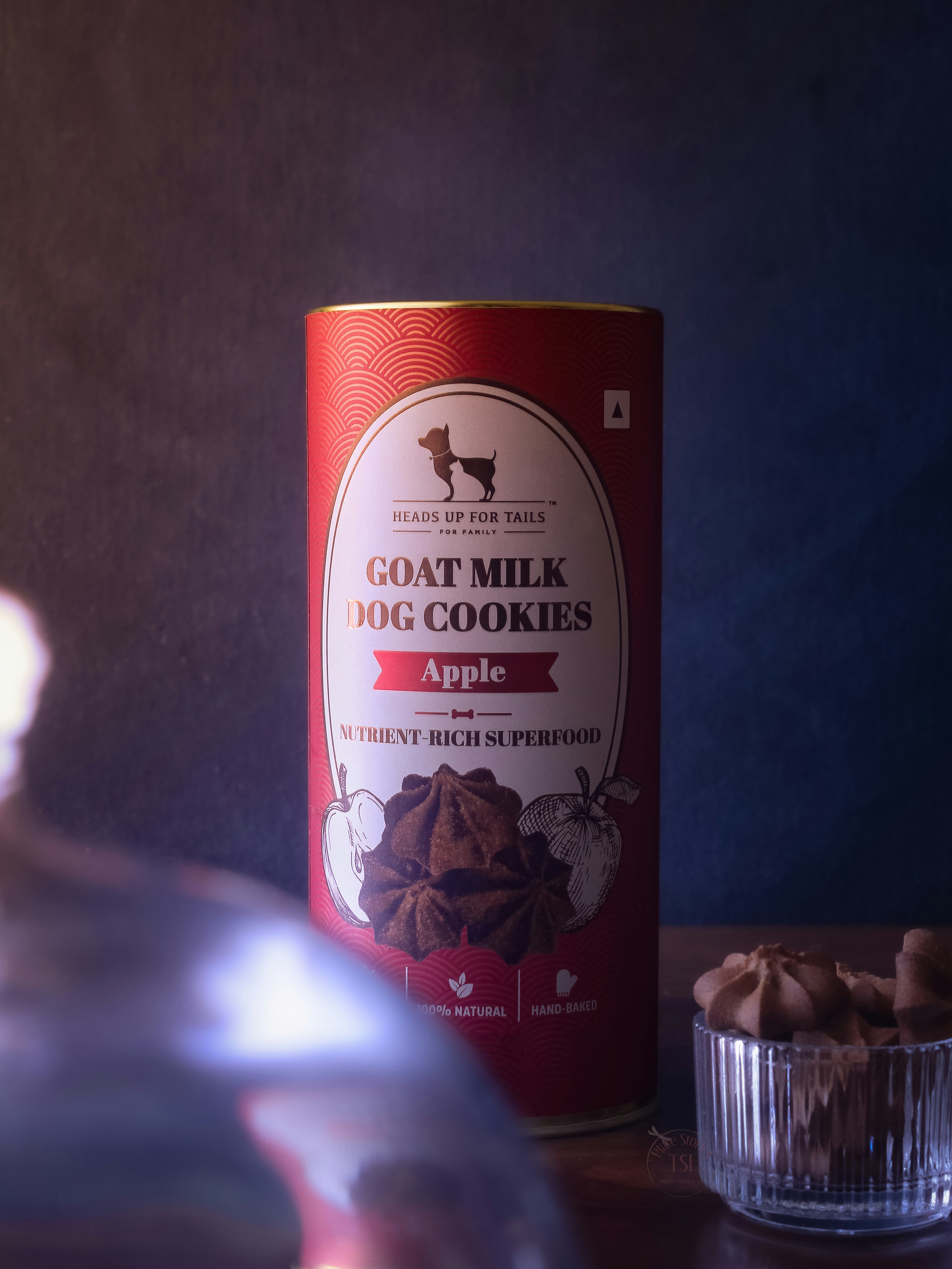 A can of goat milk next to a bowl of cookies