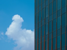 A tall building with a sky in the background
