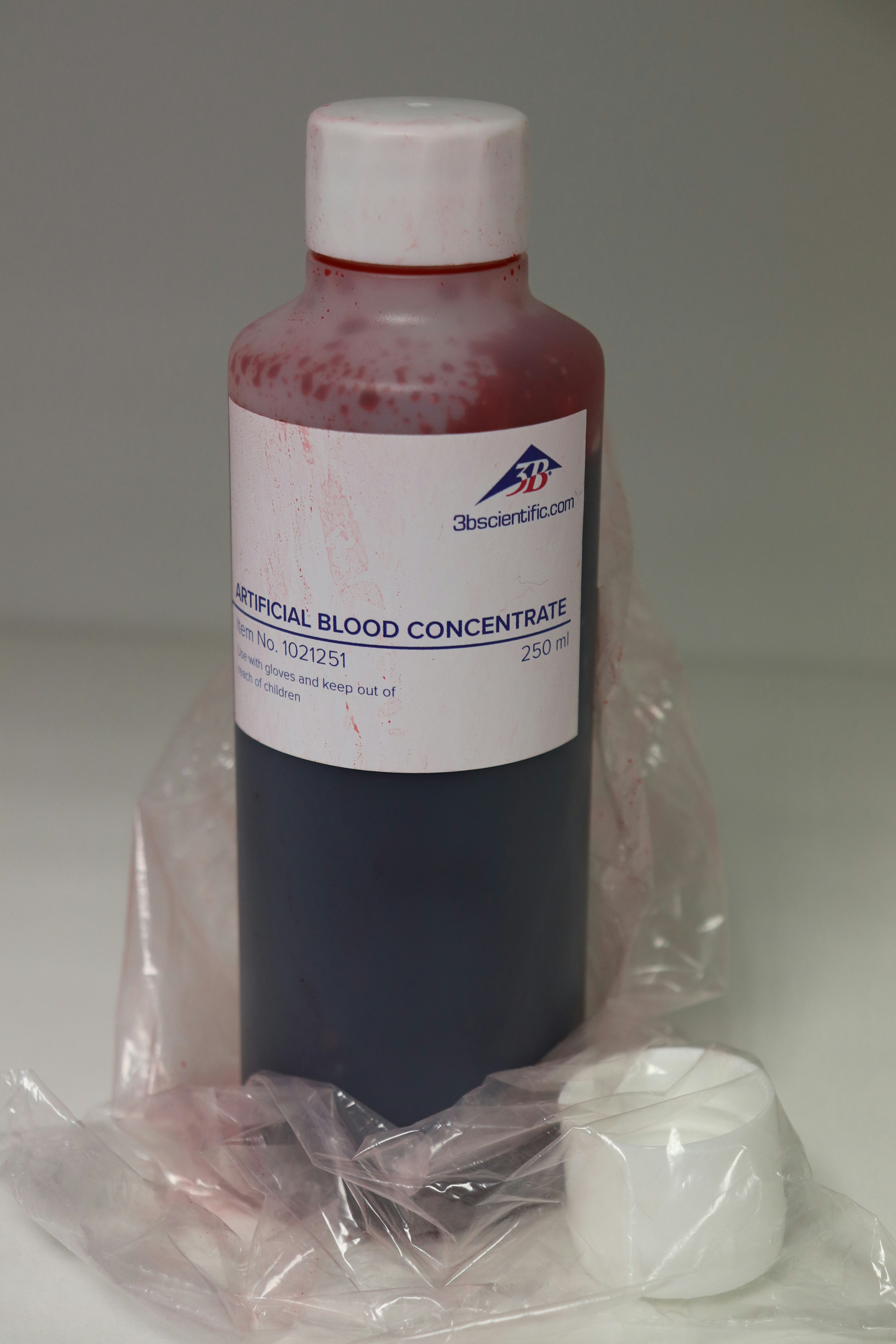 A bottle of blood sits on a plastic bag