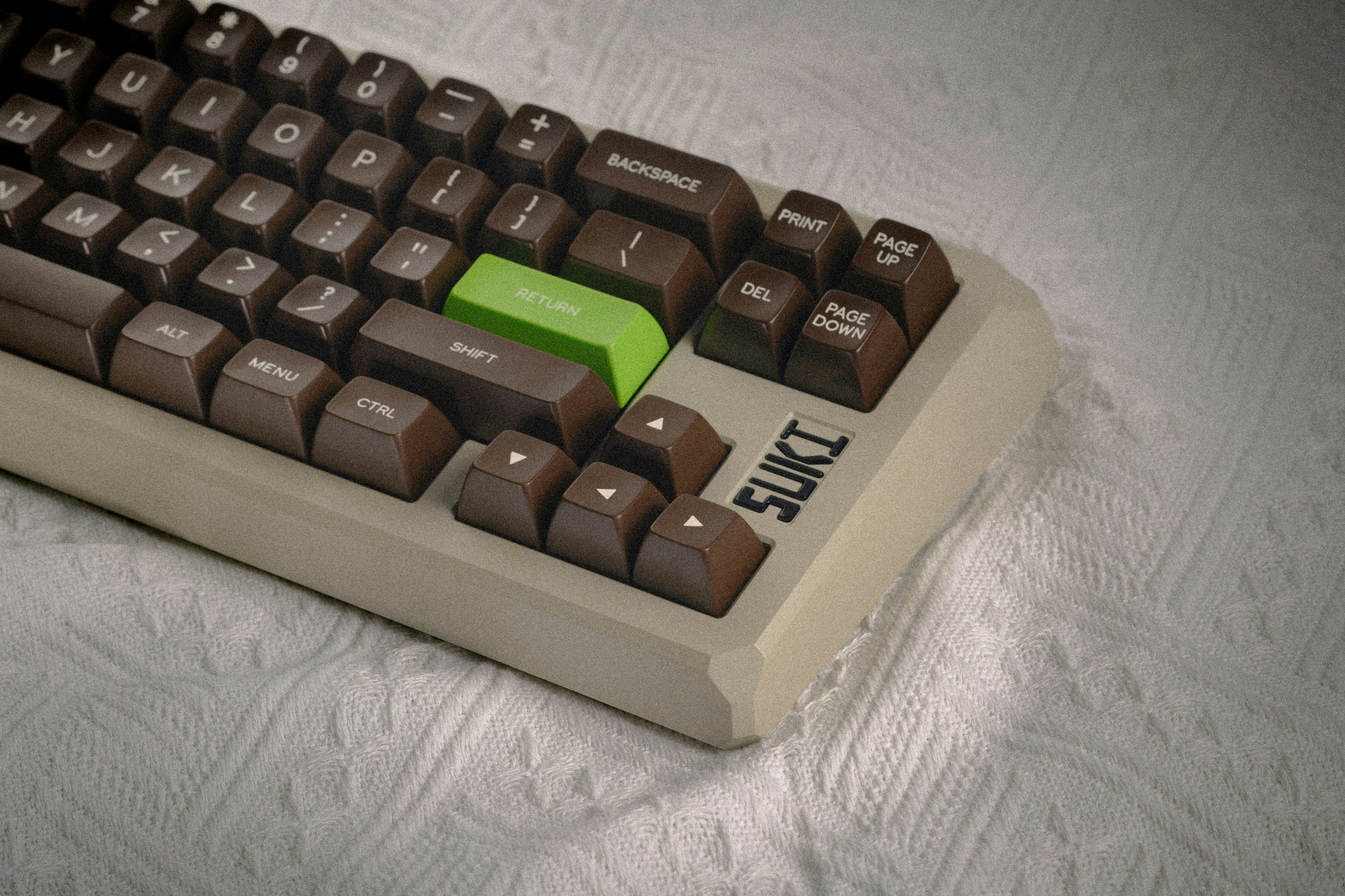 A computer keyboard sitting on top of a table