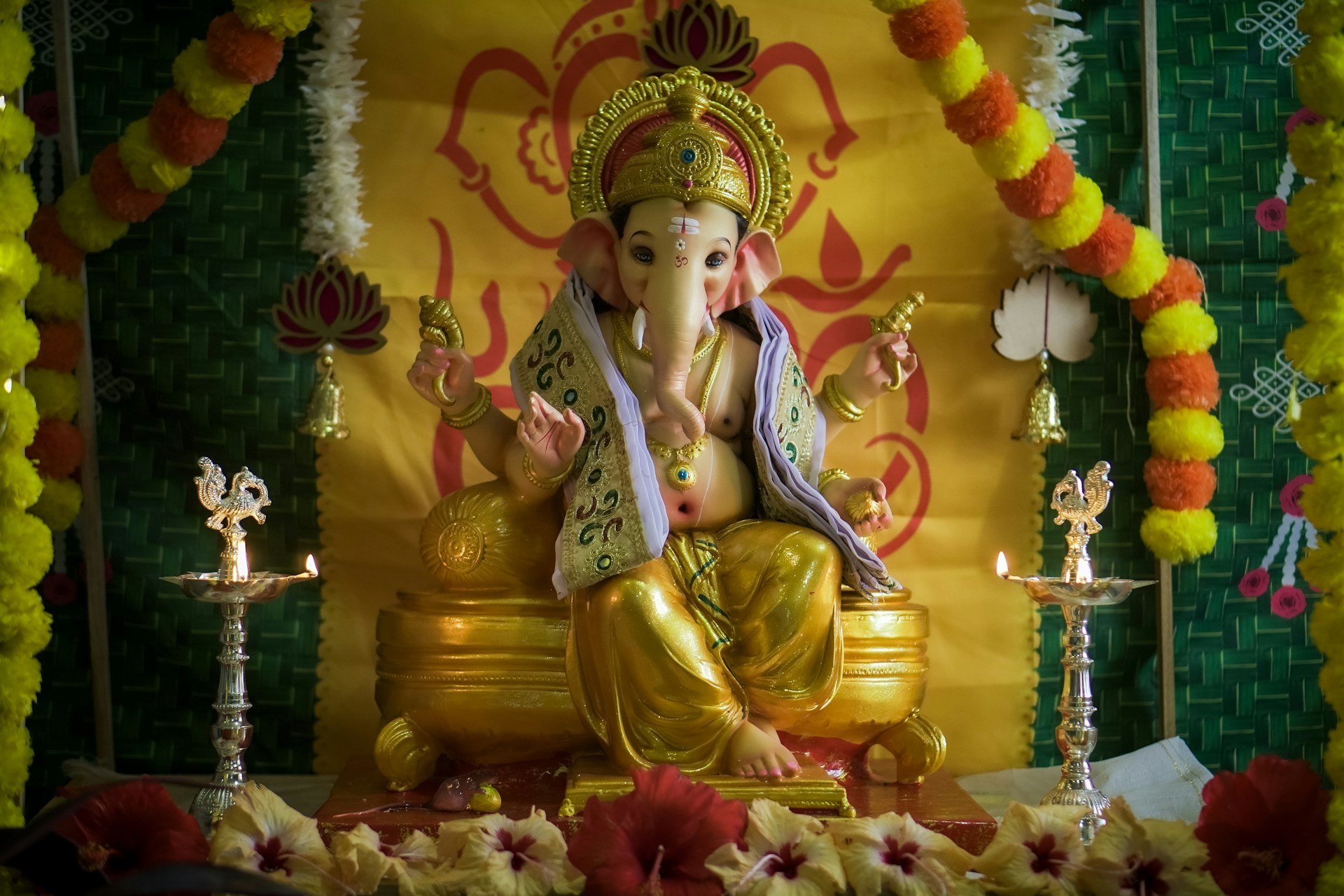 A statue of an elephant sitting on a stage