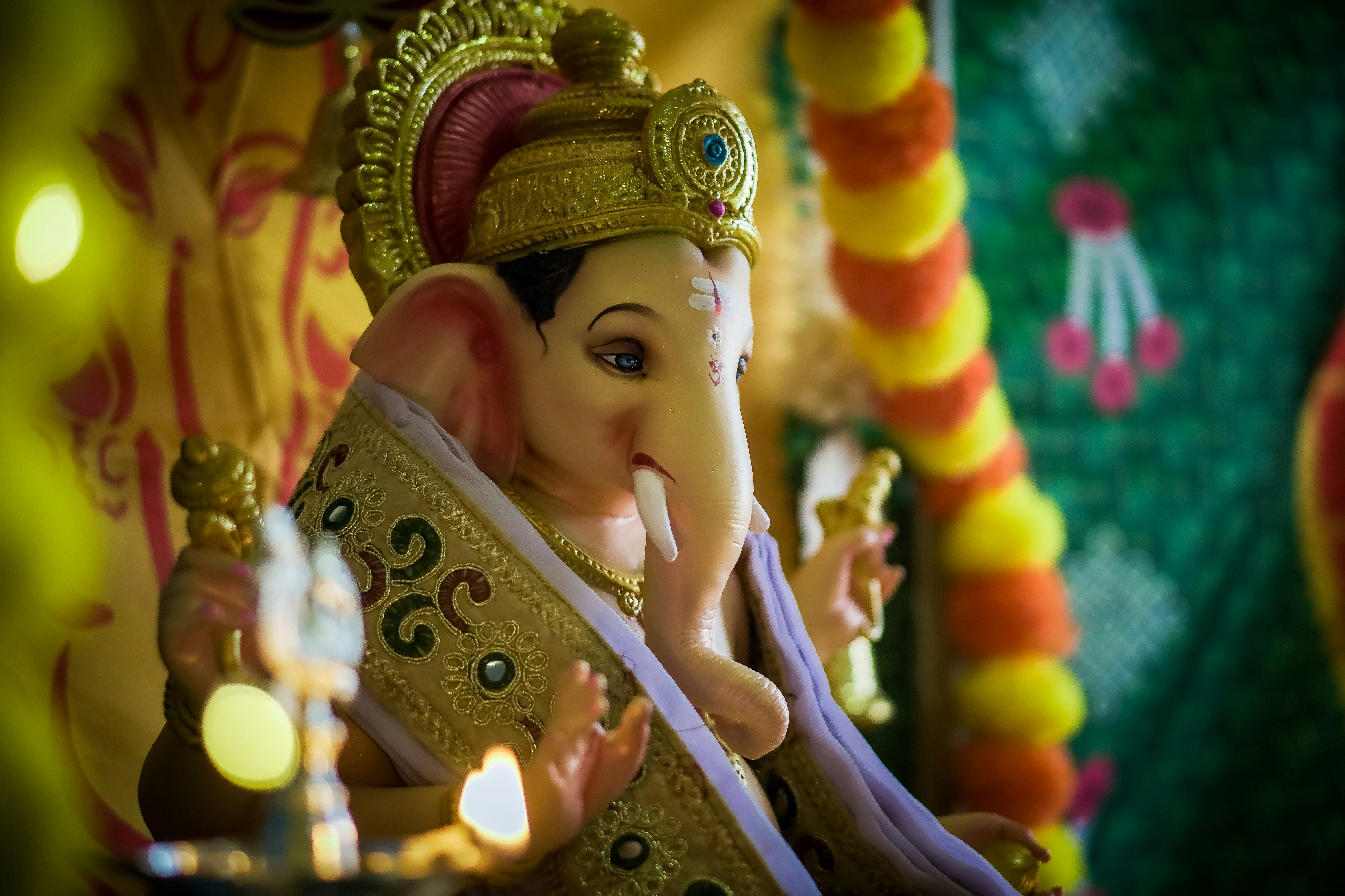 A statue of an elephant with a crown on it's head