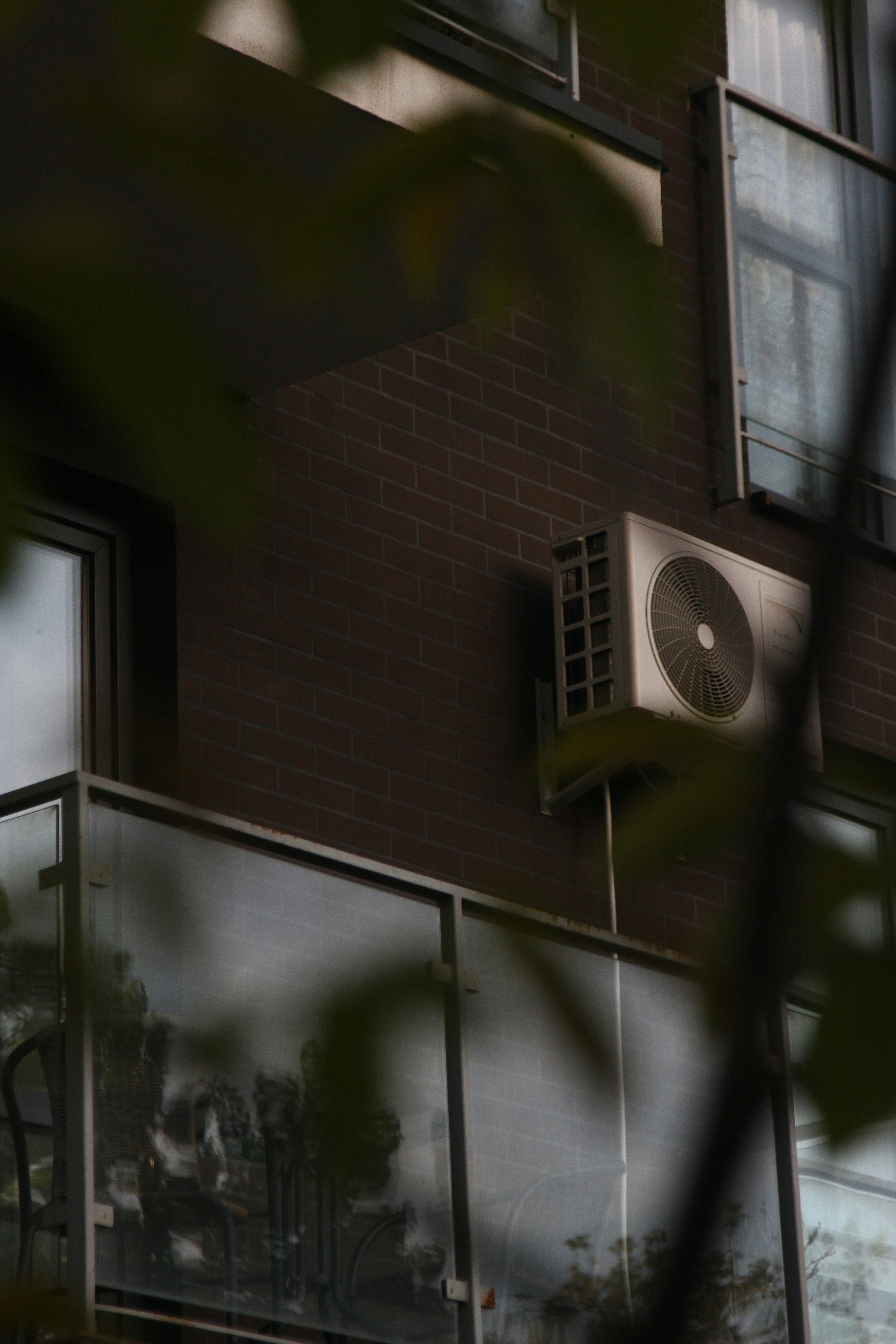 An air conditioner on the side of a building