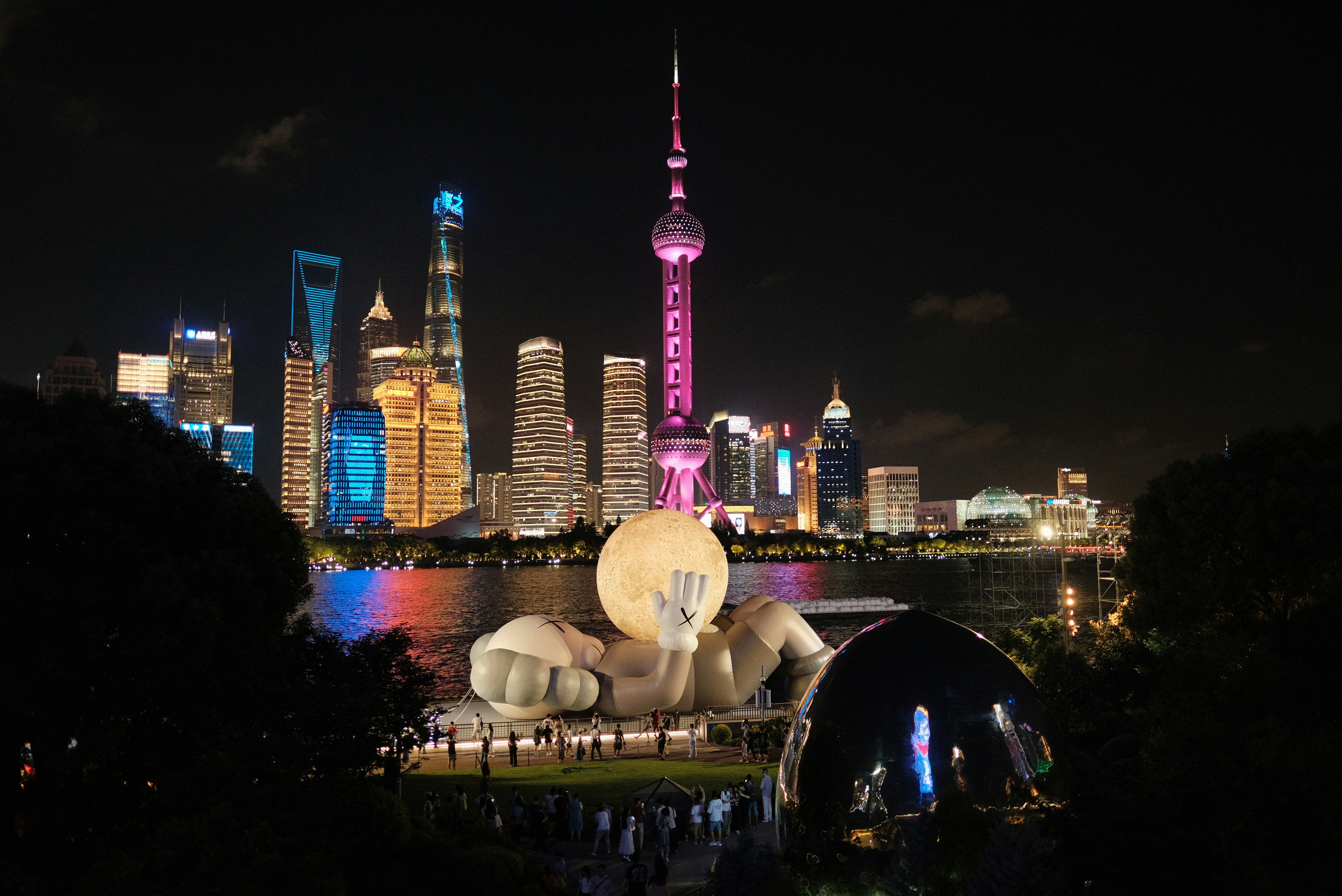 A view of a city at night from across the river, 
