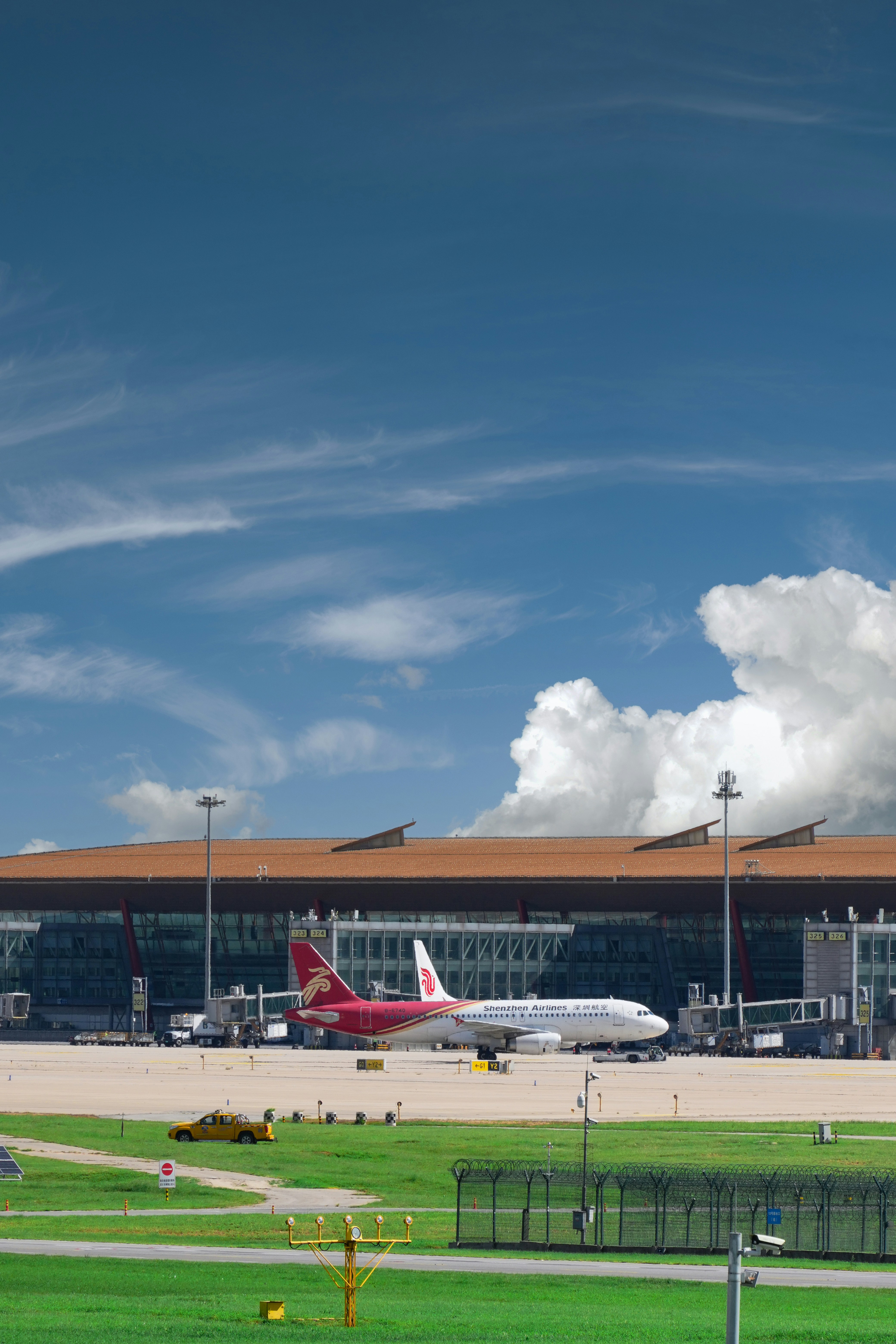 An airport with a plane on the runway
